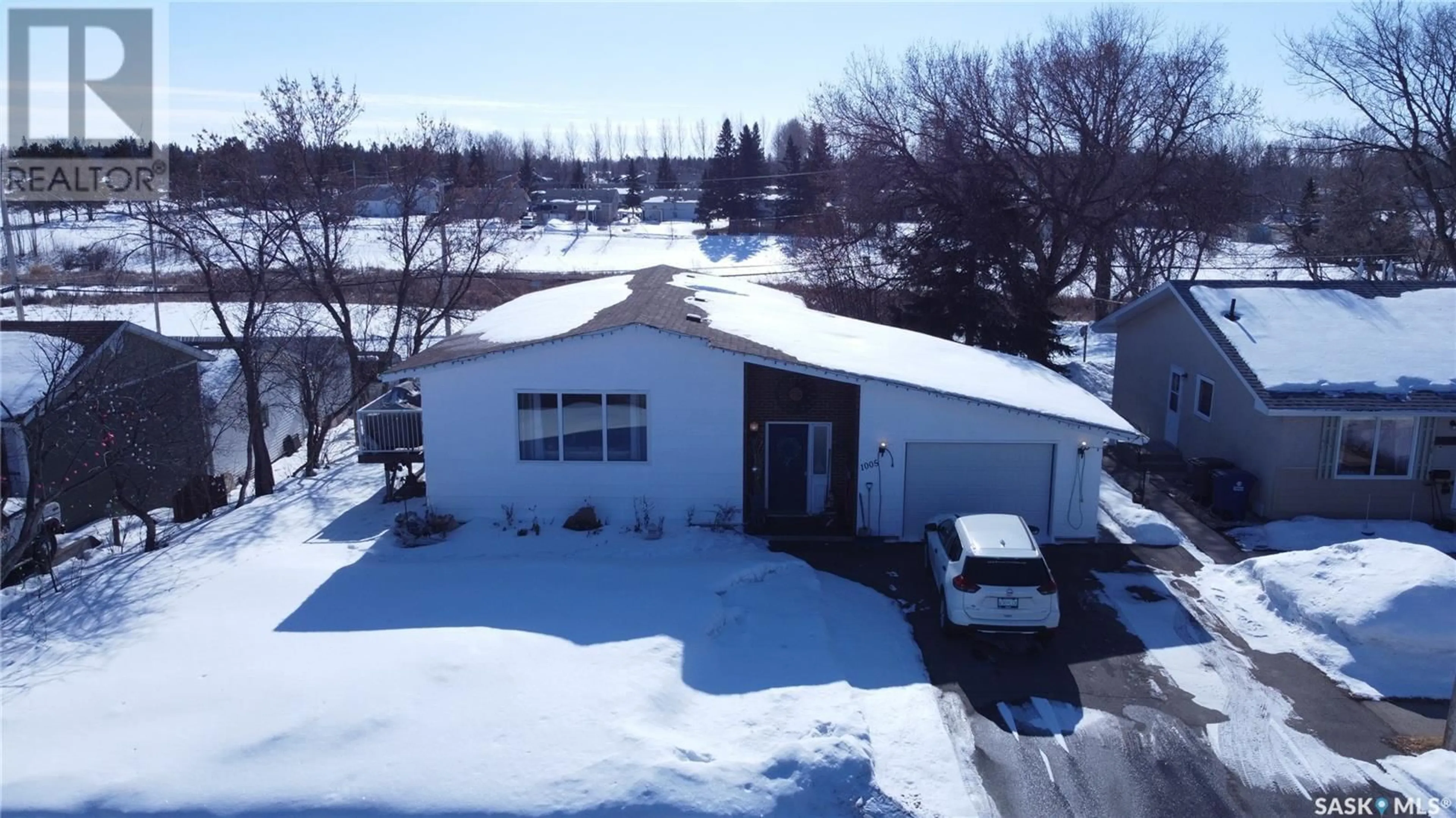 A pic from outside/outdoor area/front of a property/back of a property/a pic from drone, unknown for 1005 10th STREET, Rosthern Saskatchewan S0K3R0