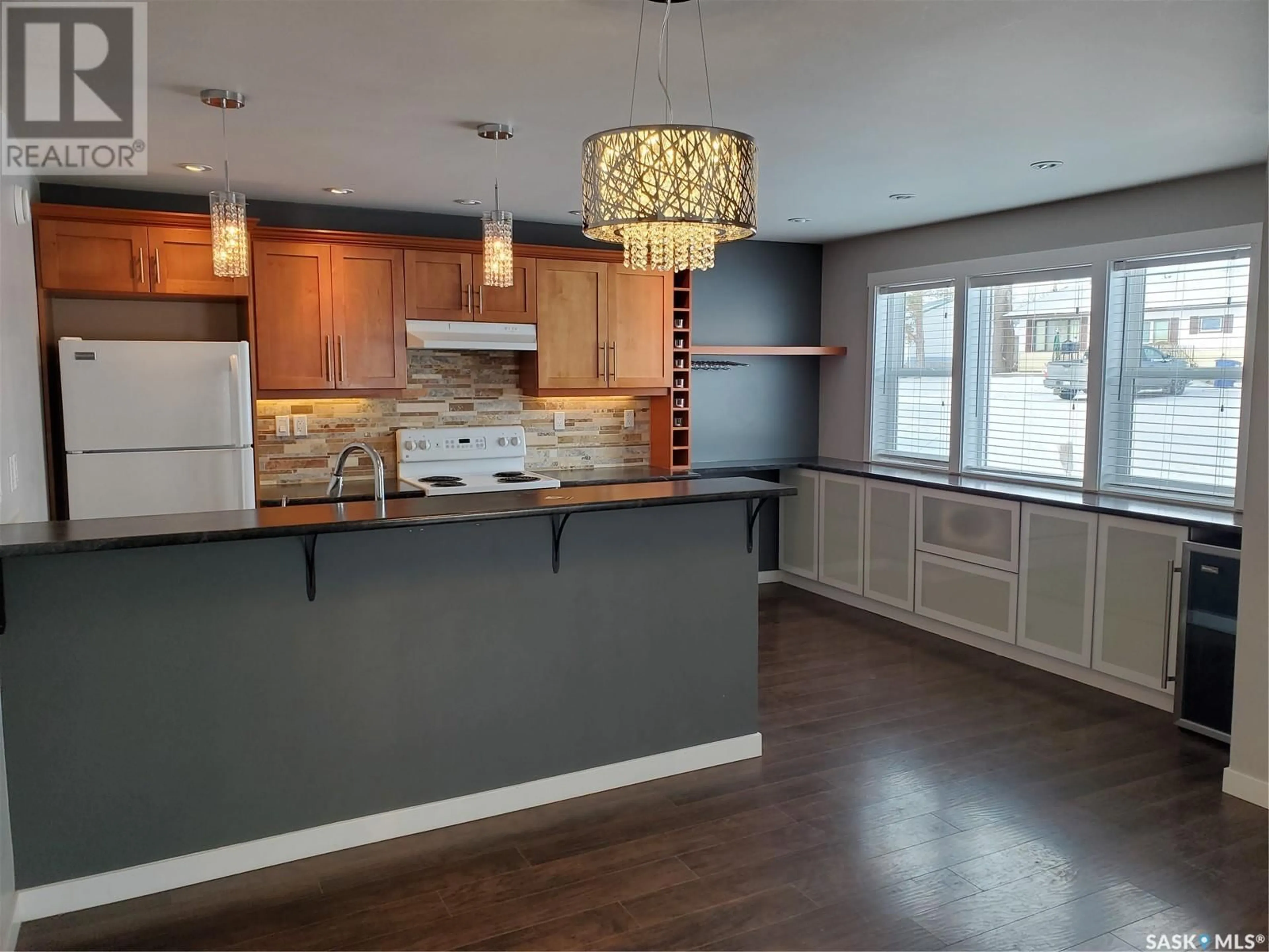 Open concept kitchen, wood/laminate floor for 113 6TH STREET, Ponteix Saskatchewan S0N1Z0