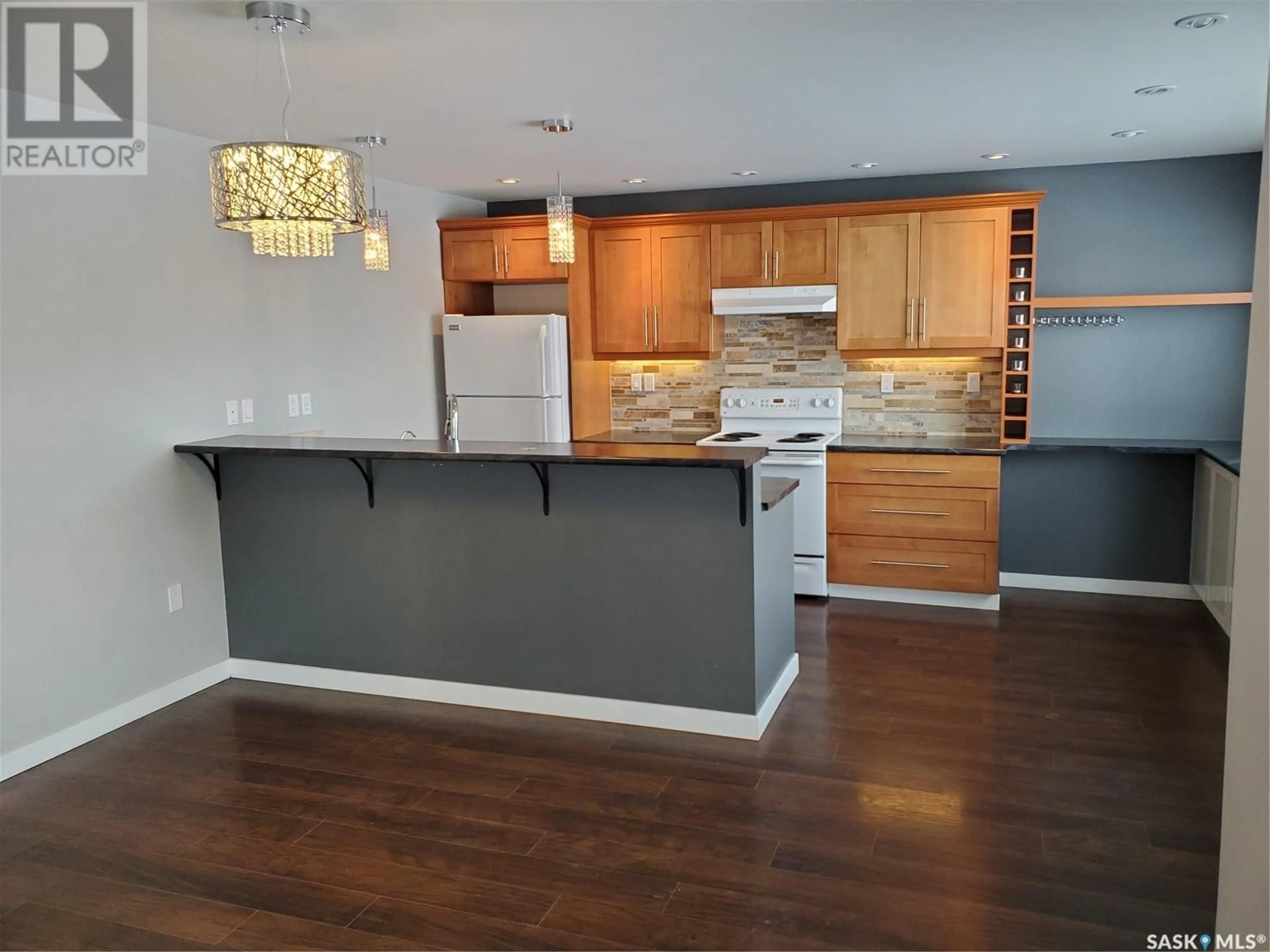 Open concept kitchen, wood/laminate floor for 113 6TH STREET, Ponteix Saskatchewan S0N1Z0