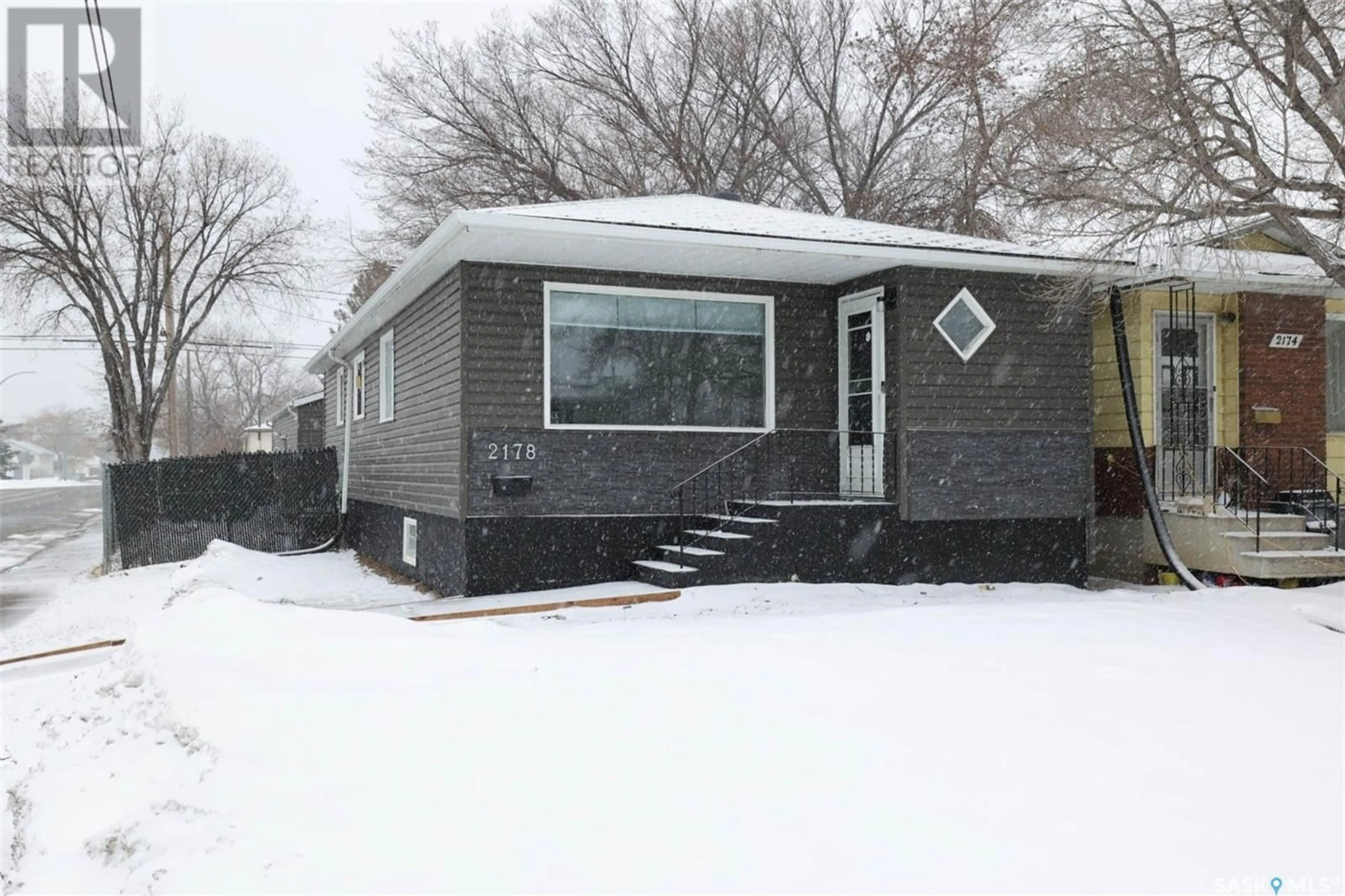 Home with vinyl exterior material, street for 2178 Francis STREET, Regina Saskatchewan S4N2P3