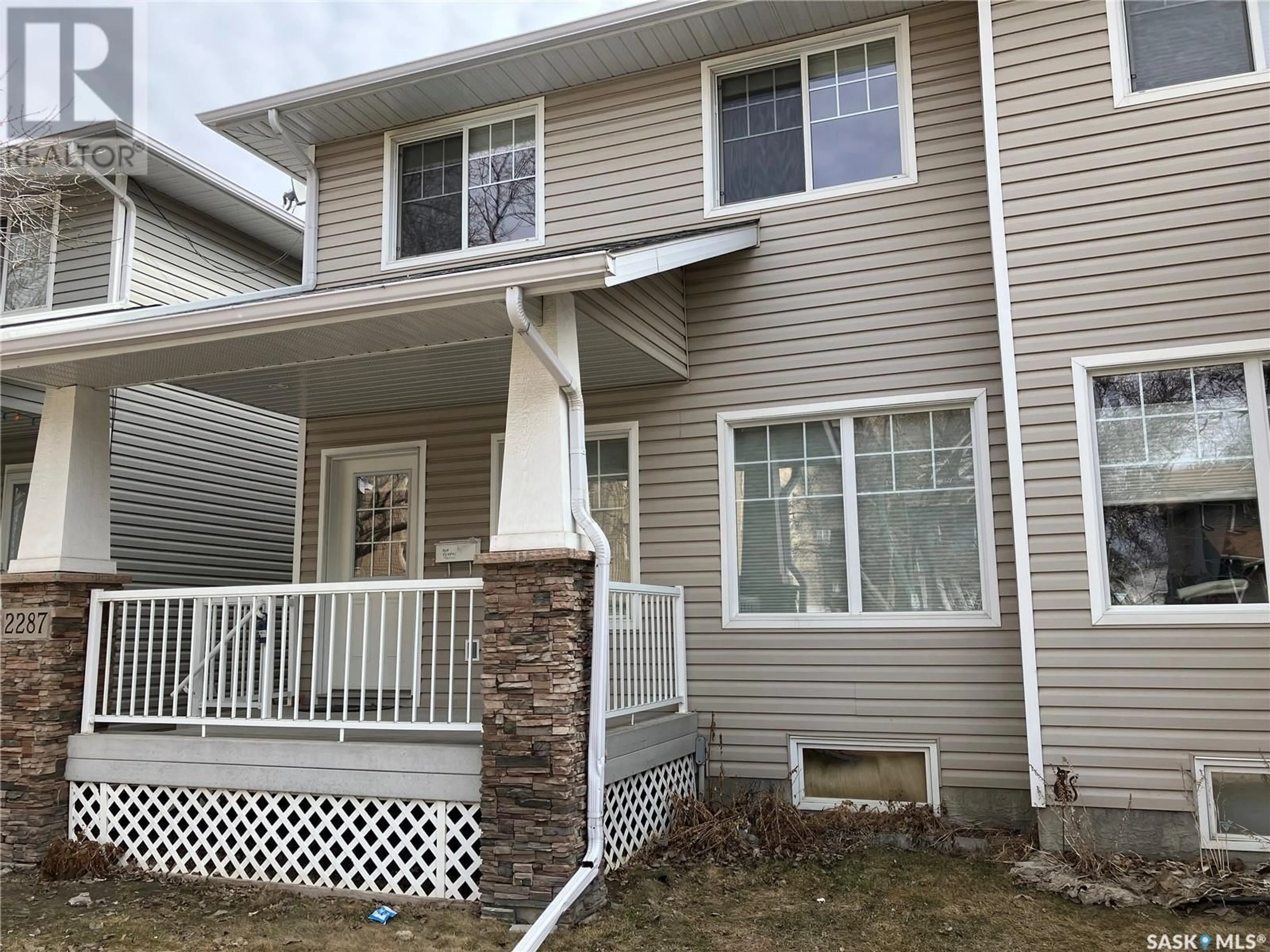 Home with vinyl exterior material, street for 2287 TREETOP LANE, Regina Saskatchewan S4P2V8
