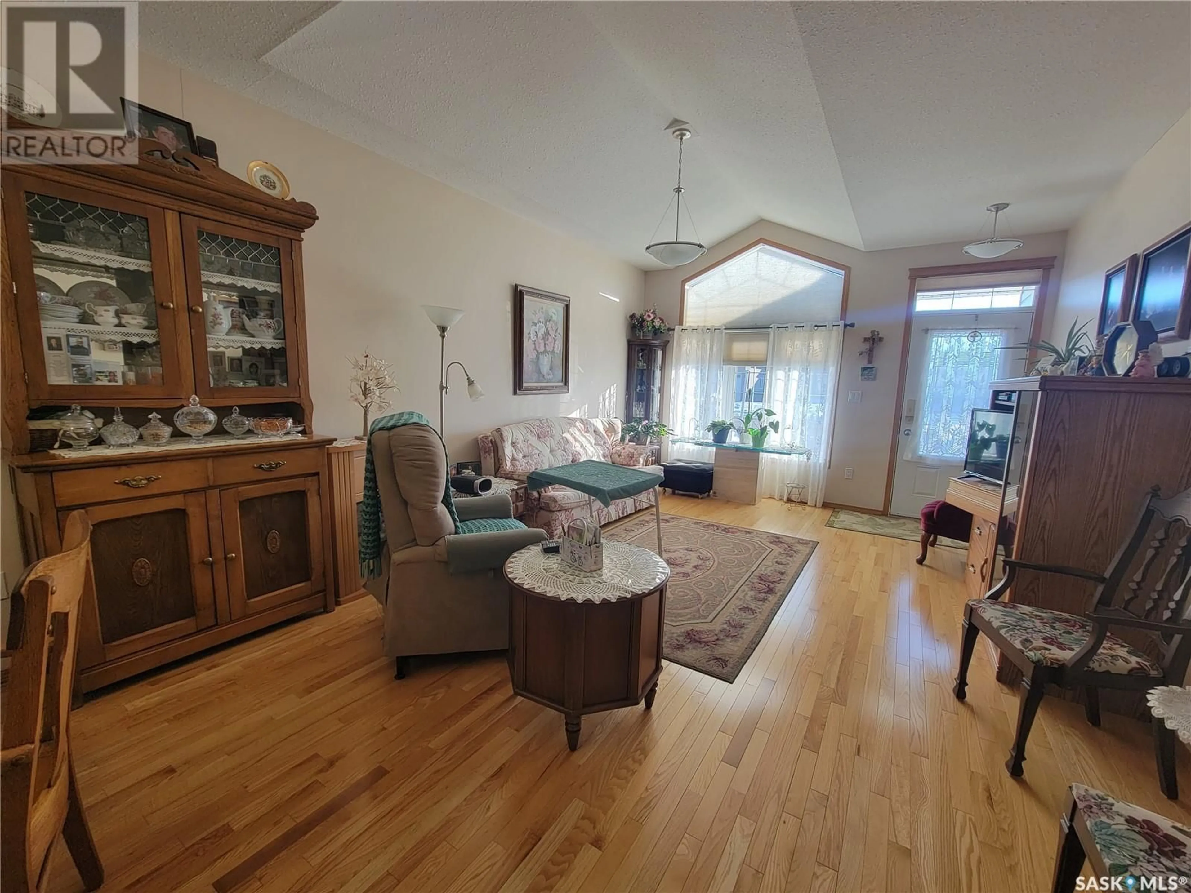 Living room with furniture, wood/laminate floor for 2 5364 PROGRESS STREET, Macklin Saskatchewan S0L2C0