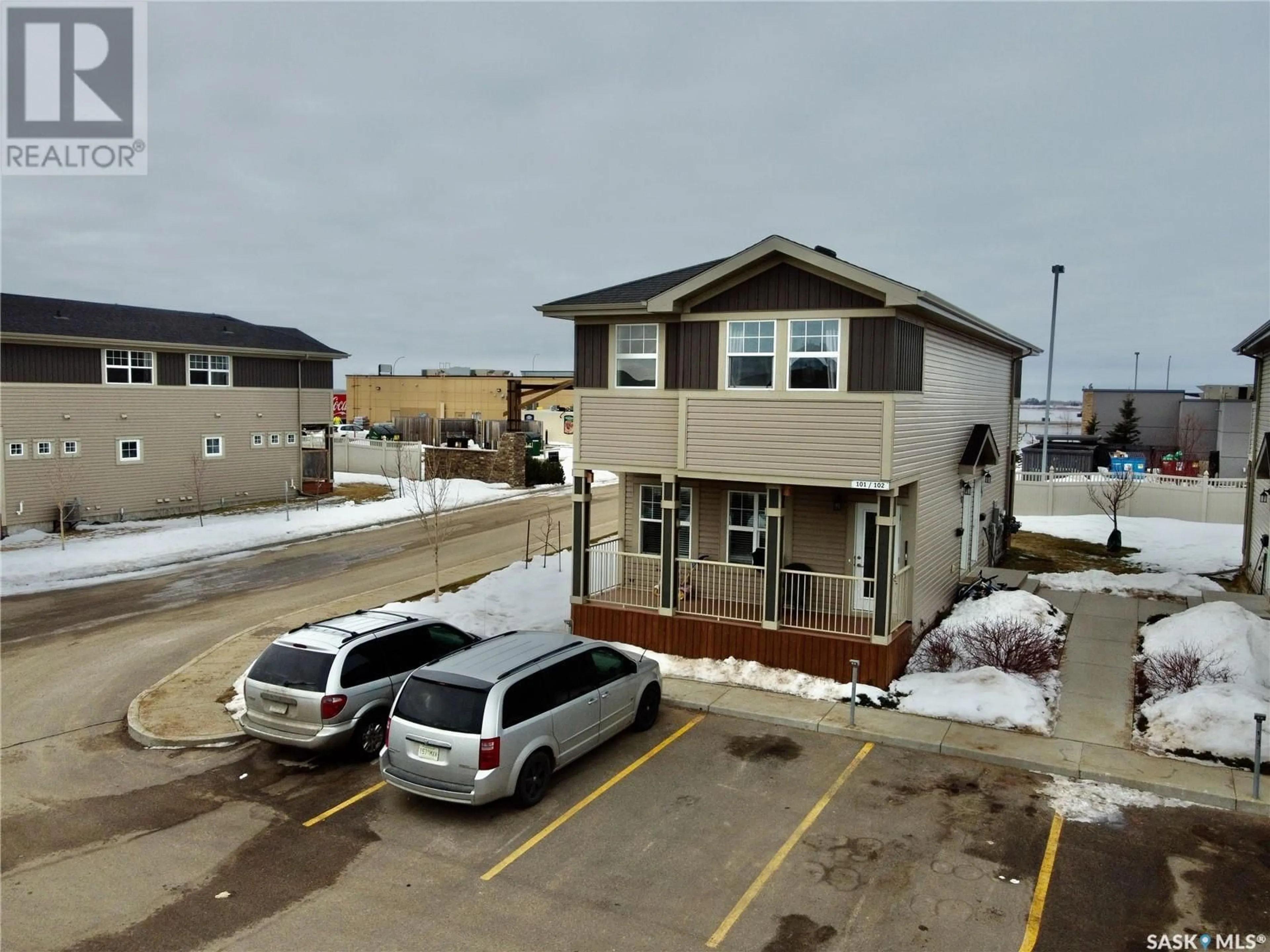 A pic from outside/outdoor area/front of a property/back of a property/a pic from drone, building for 101 100 Chaparral BOULEVARD, Martensville Saskatchewan S0K0A2