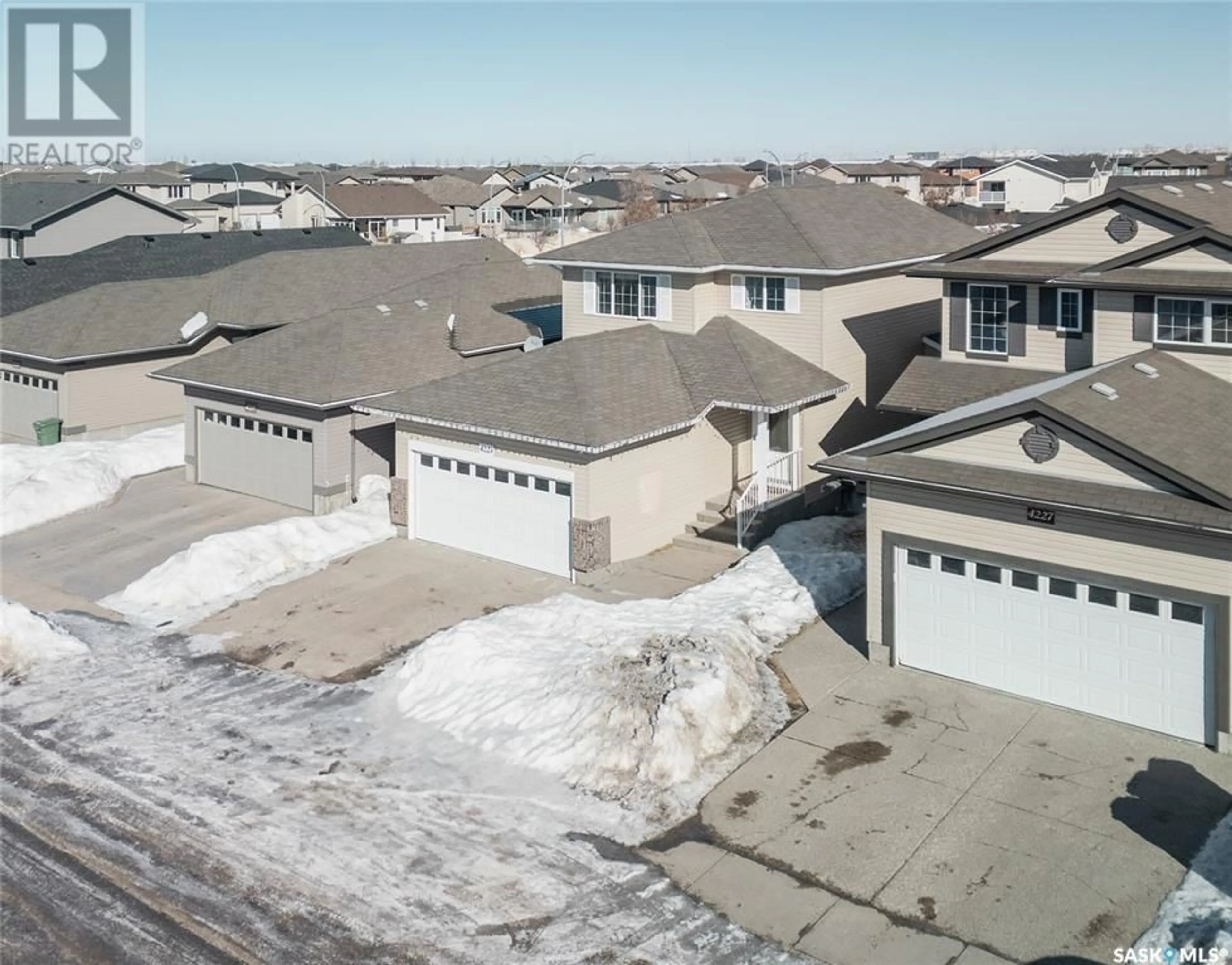 A pic from outside/outdoor area/front of a property/back of a property/a pic from drone, street for 4223 Nicurity DRIVE, Regina Saskatchewan S4X0B9