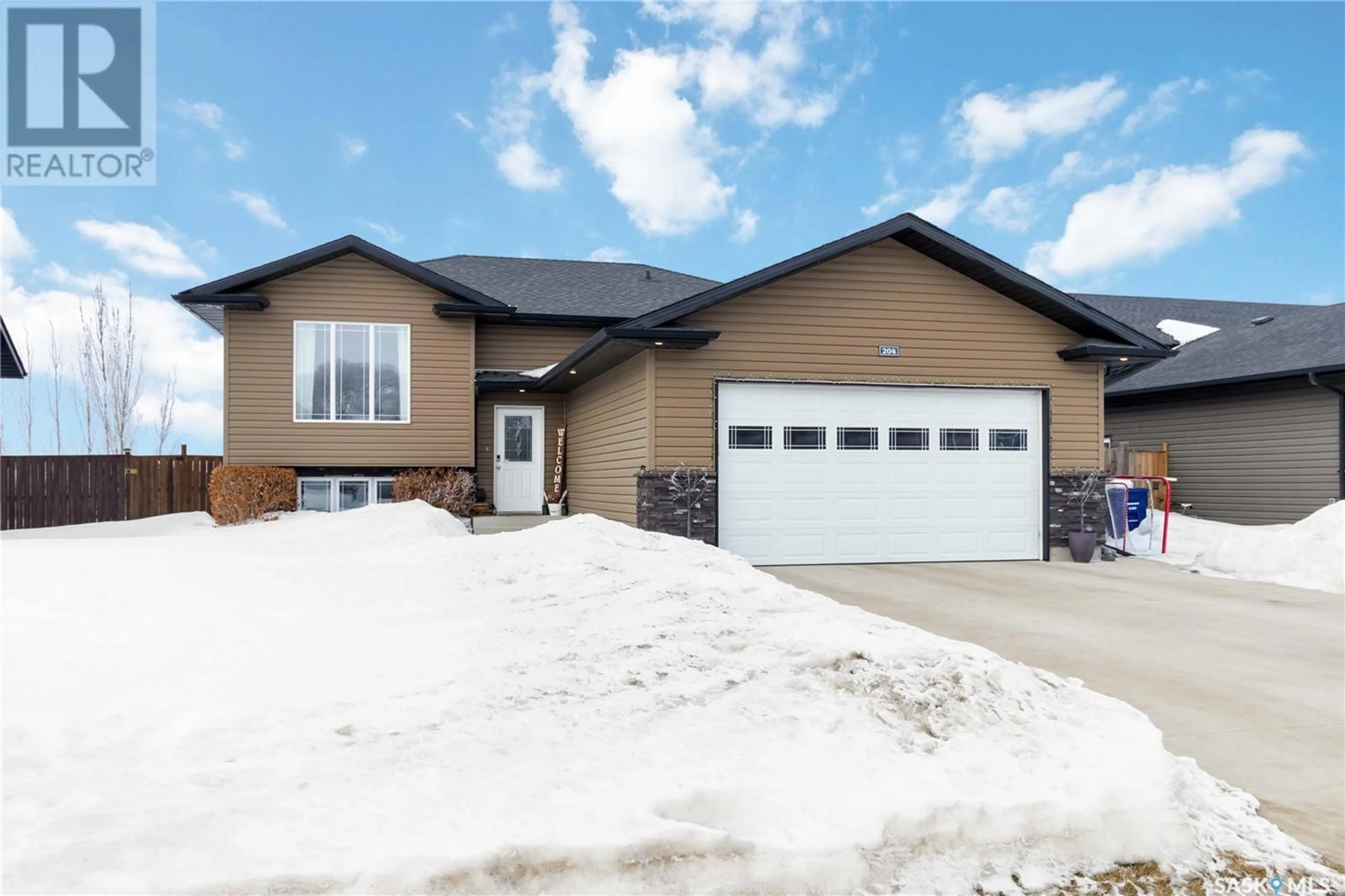 Home with vinyl exterior material, street for 204 Diefenbaker AVENUE, Hague Saskatchewan S0K1X0