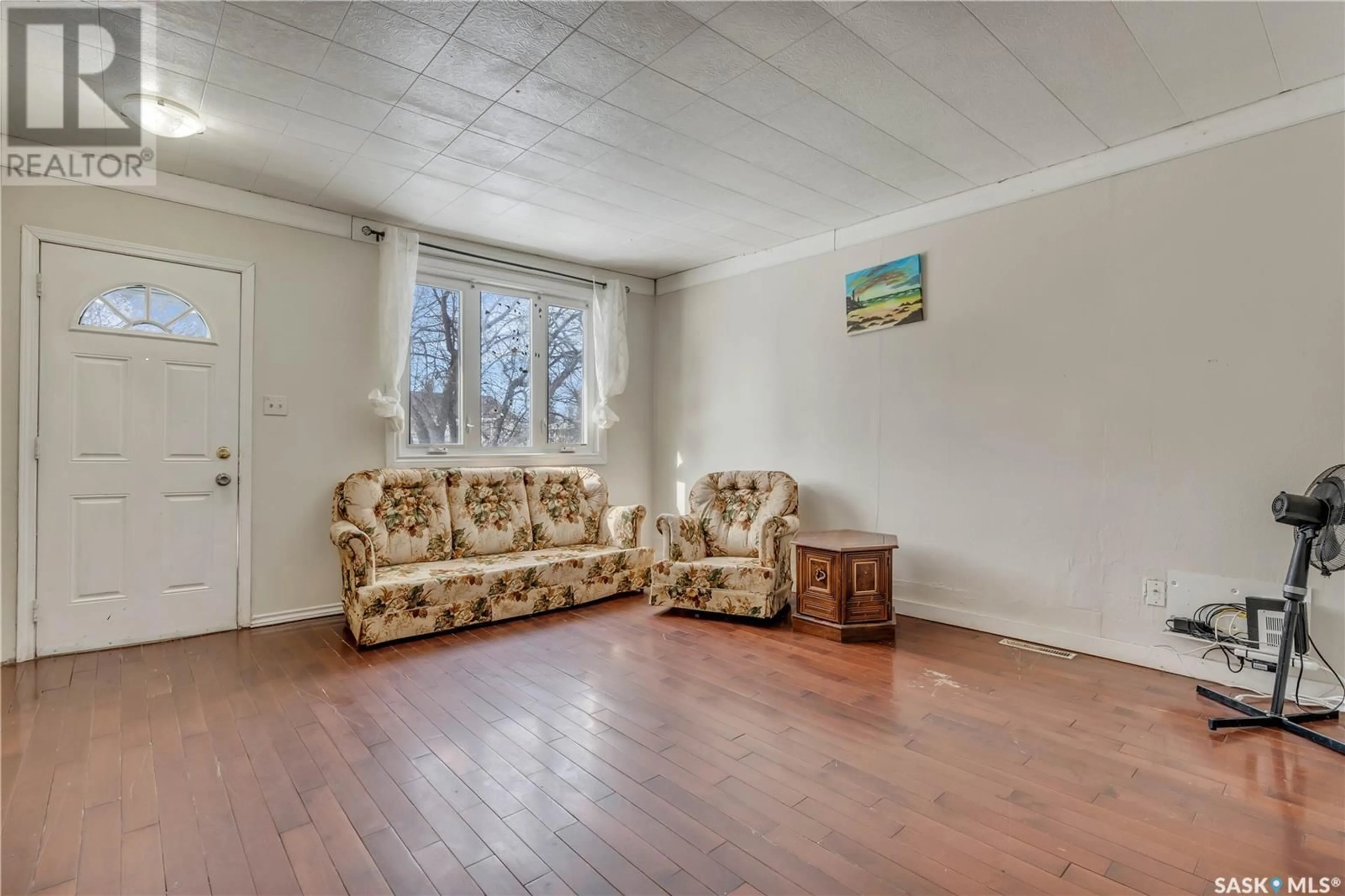 Living room with furniture, wood/laminate floor for 1777 FORGET STREET, Regina Saskatchewan S4T4Y6