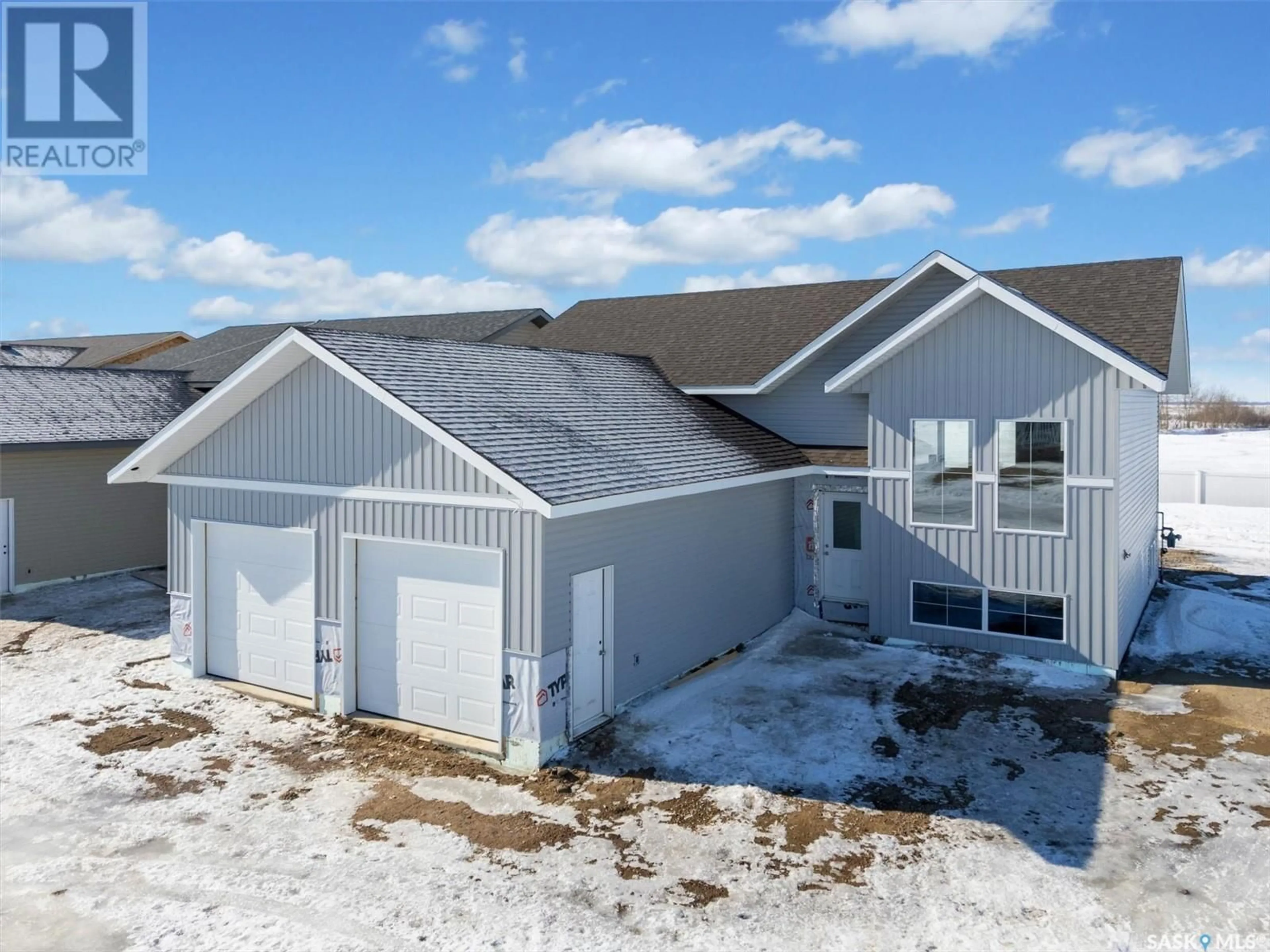 A pic from outside/outdoor area/front of a property/back of a property/a pic from drone, building for 242 Prairie Dawn DRIVE, Dundurn Saskatchewan S0K1K1