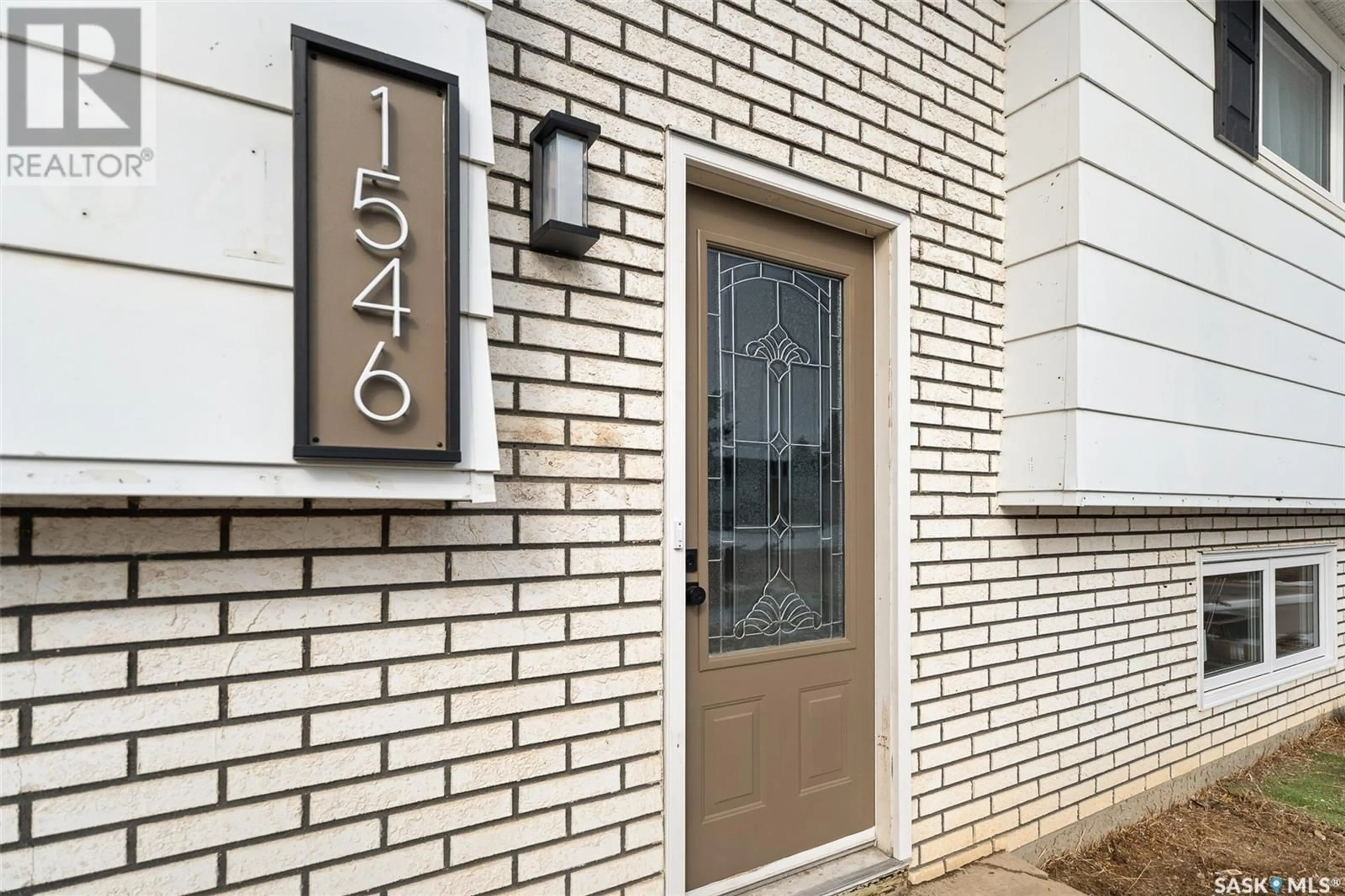Home with brick exterior material, street for 1546 WARNER STREET, Moose Jaw Saskatchewan S6H5G3