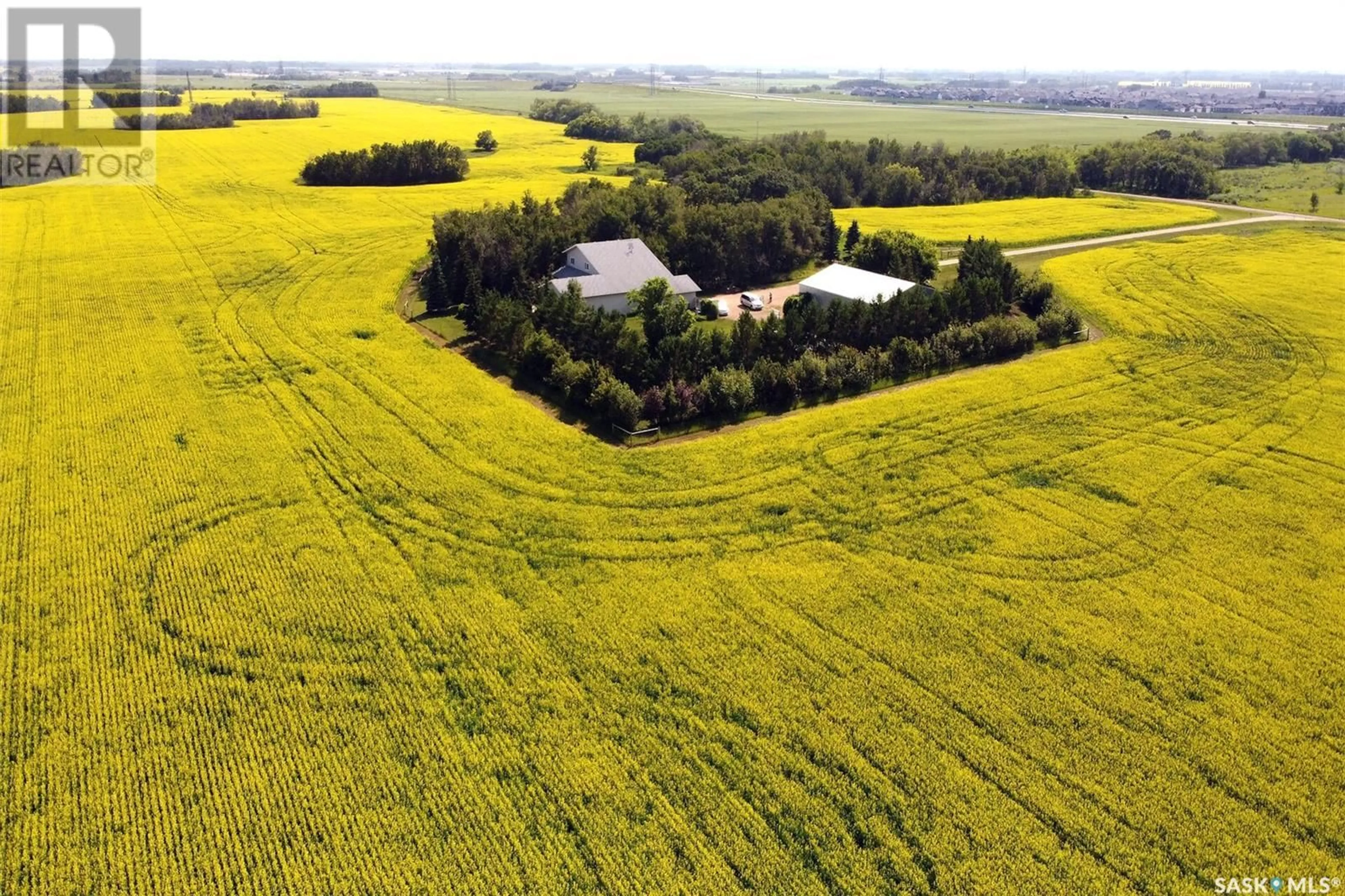 A pic from outside/outdoor area/front of a property/back of a property/a pic from drone, unknown for PRIVATE COUNTRY LIVING AT THE CITY'S EDGE, Corman Park Rm No. 344 Saskatchewan S7K3J8