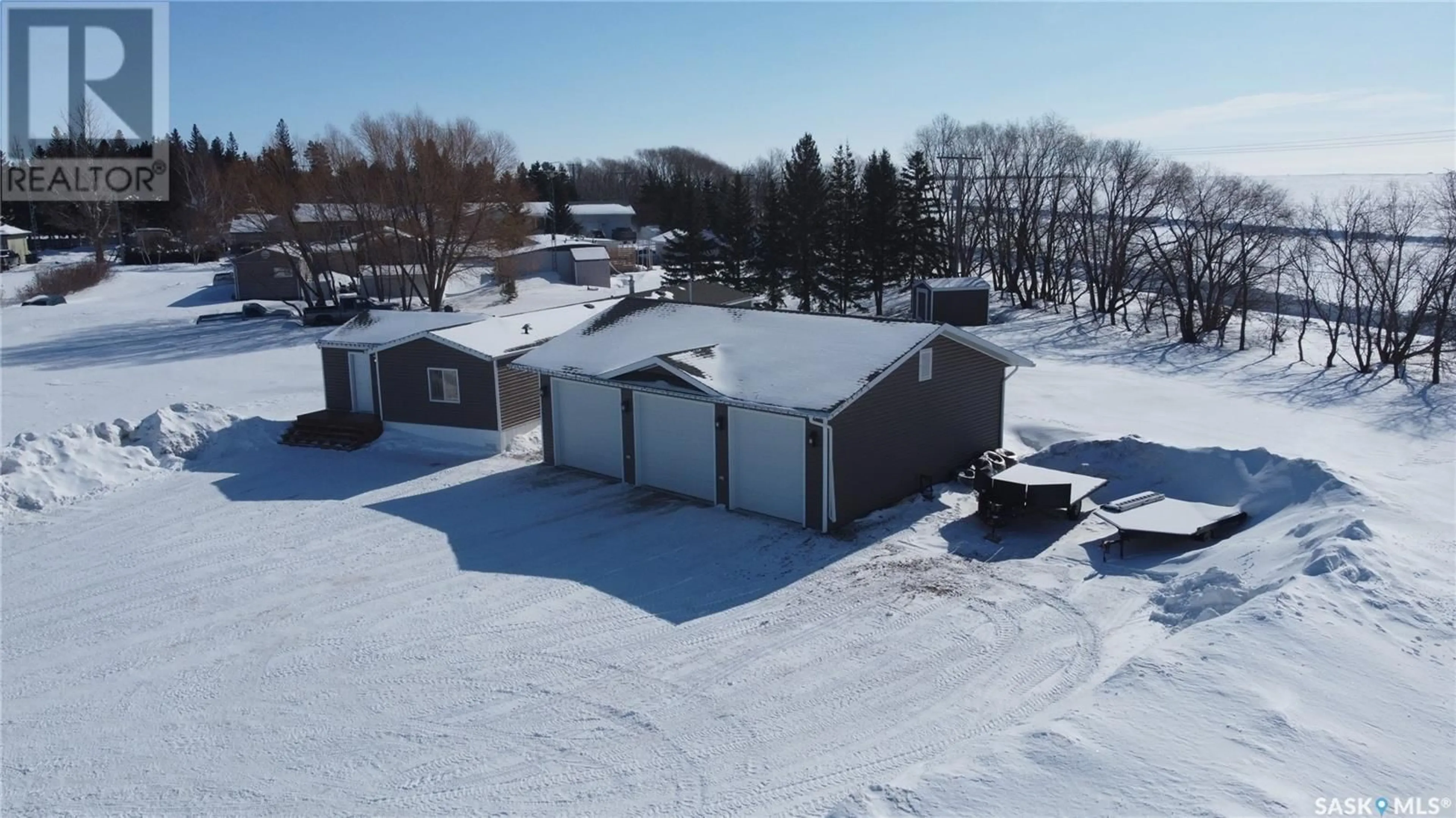 A pic from outside/outdoor area/front of a property/back of a property/a pic from drone, unknown for 105 WILLOW BAY, Annaheim Saskatchewan S0K0G0