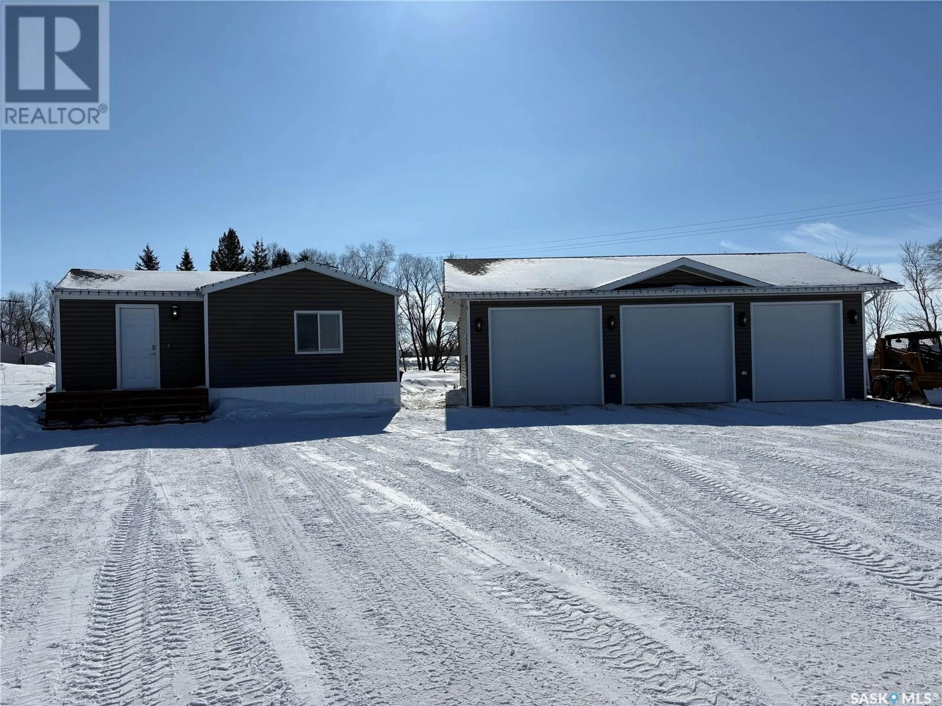A pic from outside/outdoor area/front of a property/back of a property/a pic from drone, unknown for 105 WILLOW BAY, Annaheim Saskatchewan S0K0G0