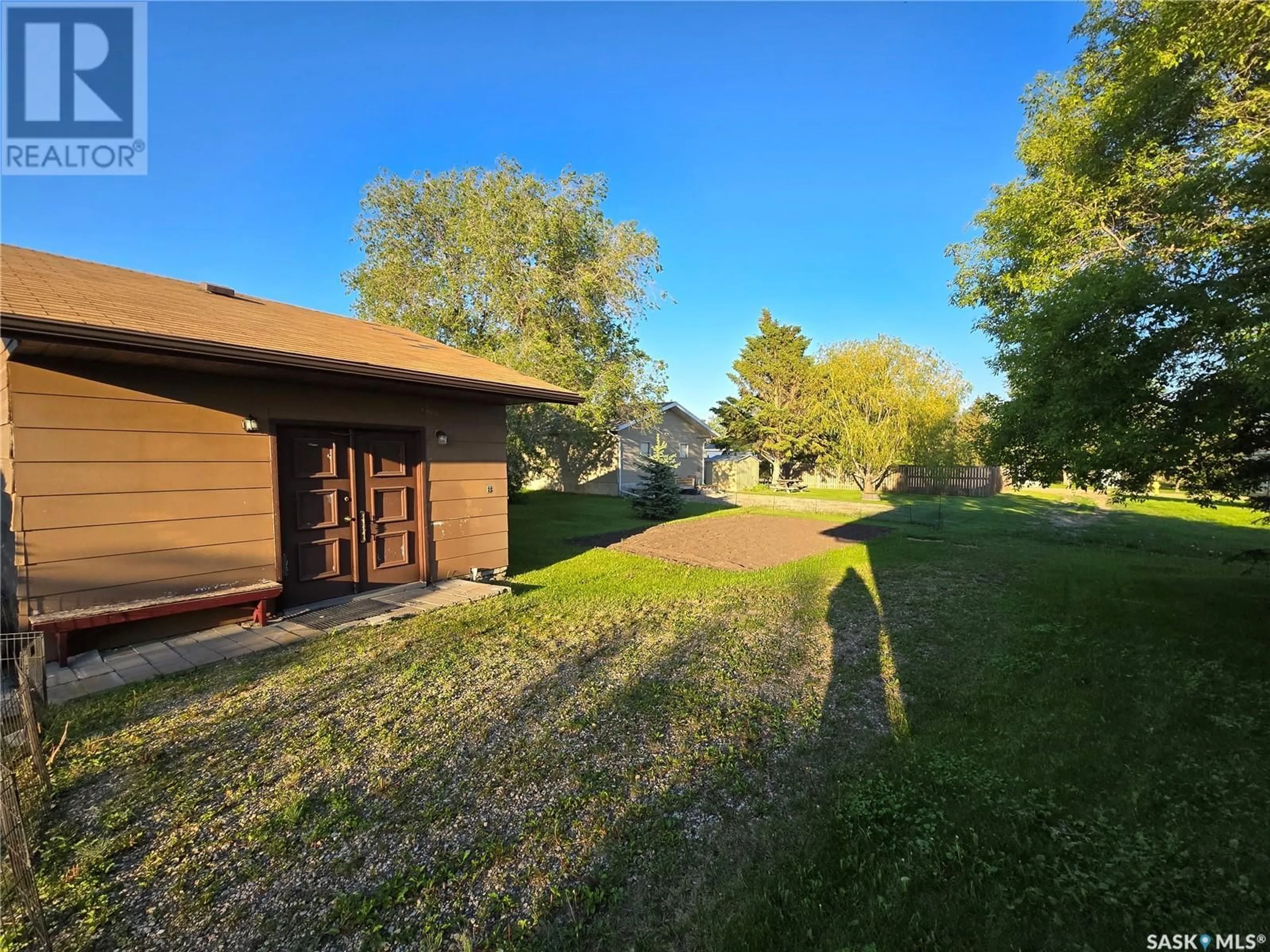 A pic from outside/outdoor area/front of a property/back of a property/a pic from drone, forest/trees view for 100 LUNDY PLACE, Stoughton Saskatchewan S0G4T0
