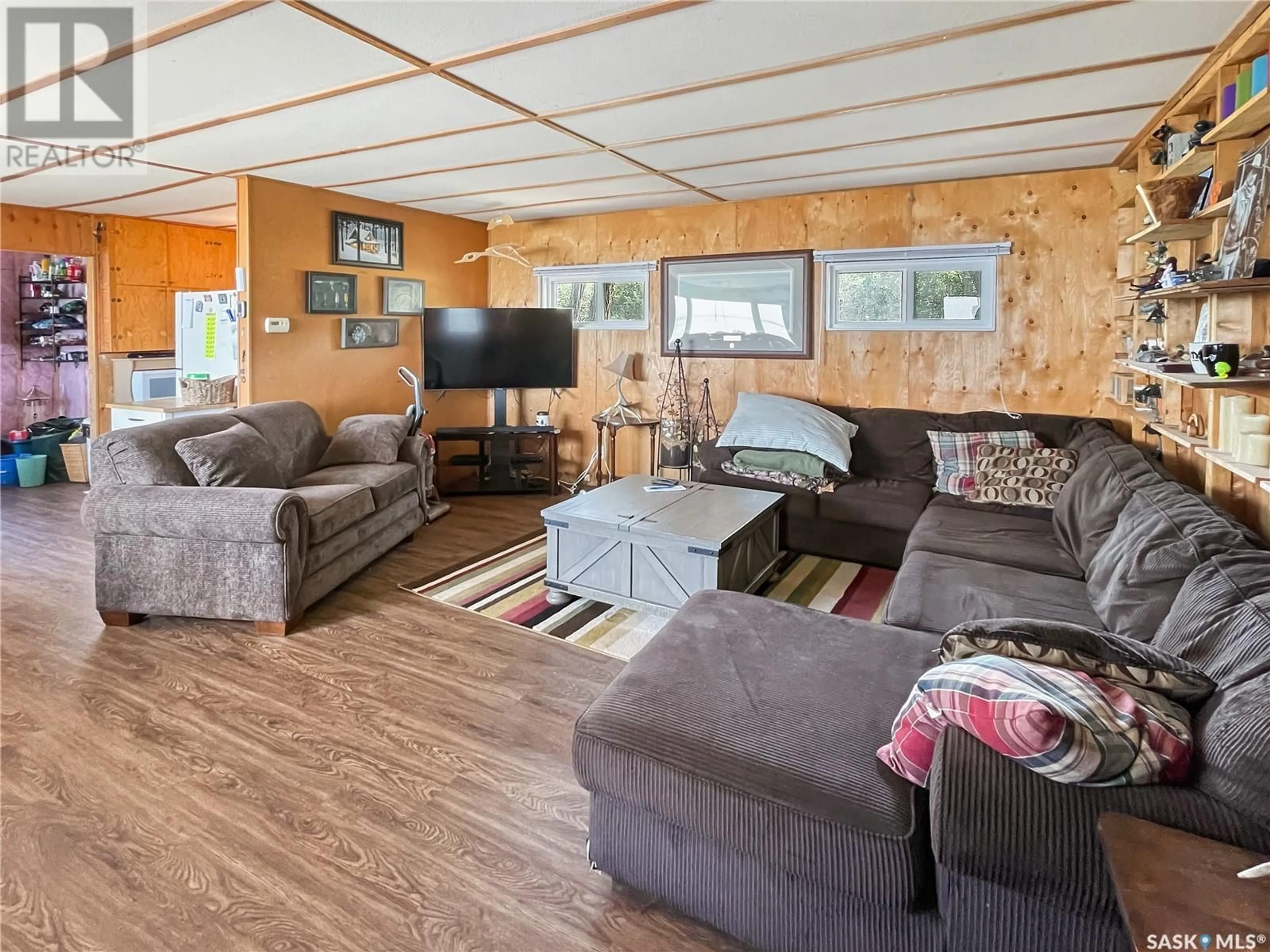 Living room with furniture, wood/laminate floor for 9 KILCARE DRIVE, Meota Rm No.468 Saskatchewan S0M1X0