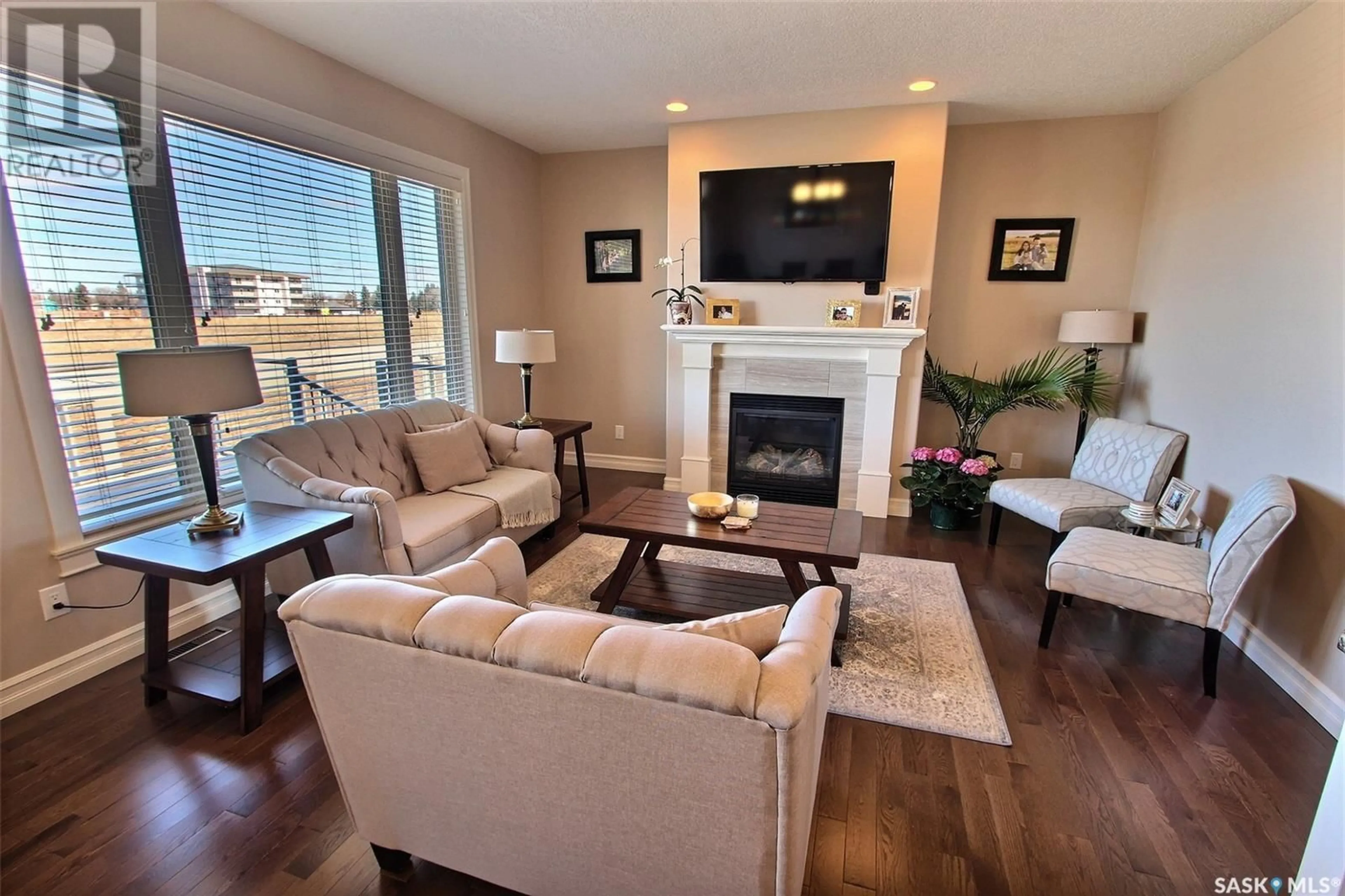 Living room with furniture, wood/laminate floor for 17 2805 LAKEVIEW DRIVE, Prince Albert Saskatchewan S6W0A4