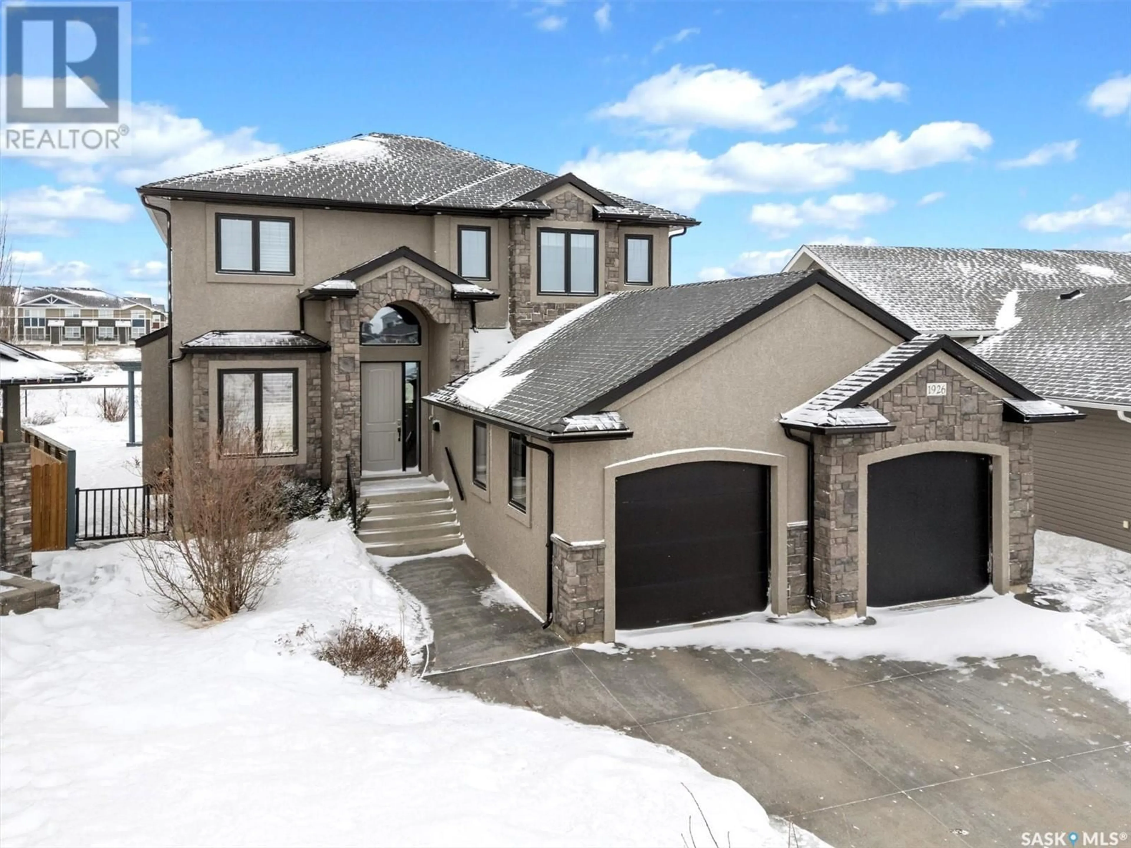 Home with brick exterior material, street for 1926 POHORECKY TERRACE, Saskatoon Saskatchewan S7W0J1