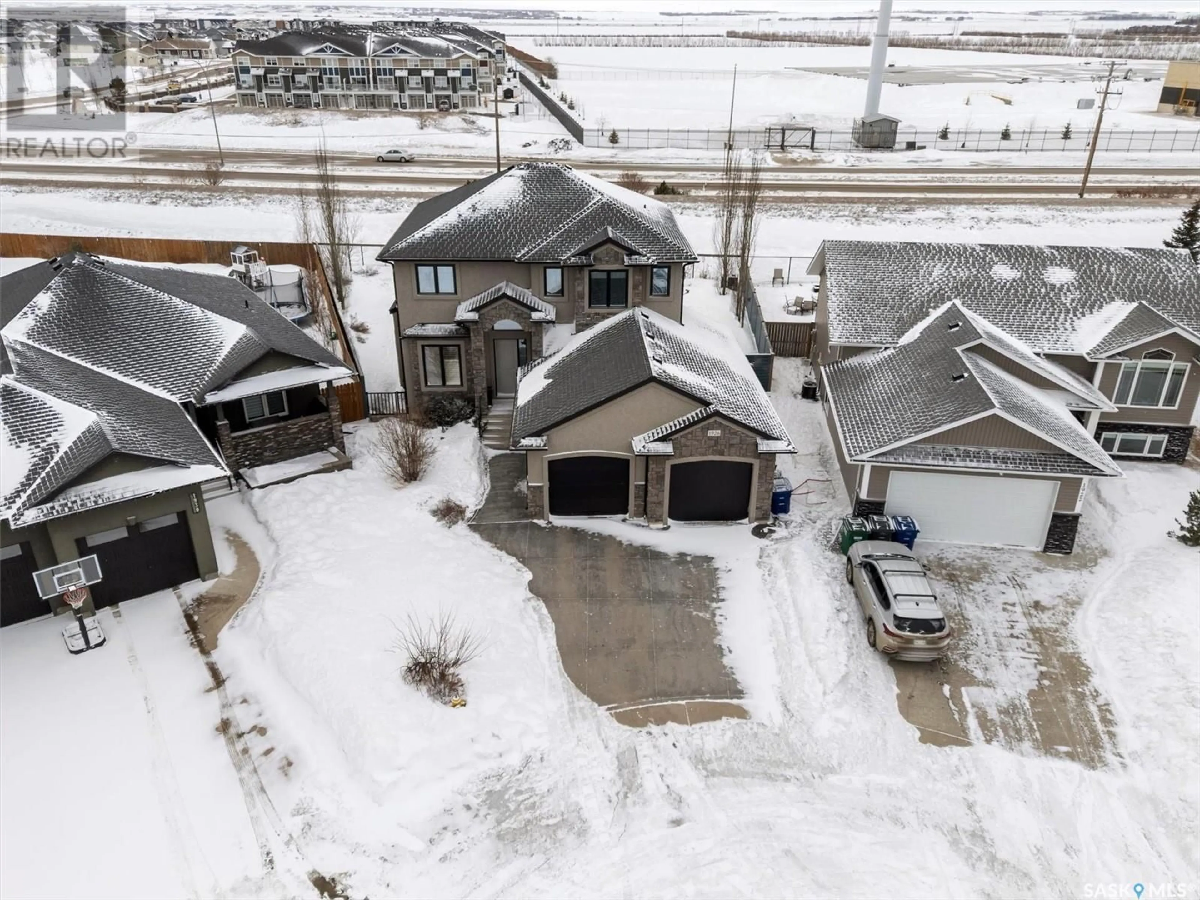 A pic from outside/outdoor area/front of a property/back of a property/a pic from drone, street for 1926 POHORECKY TERRACE, Saskatoon Saskatchewan S7W0J1