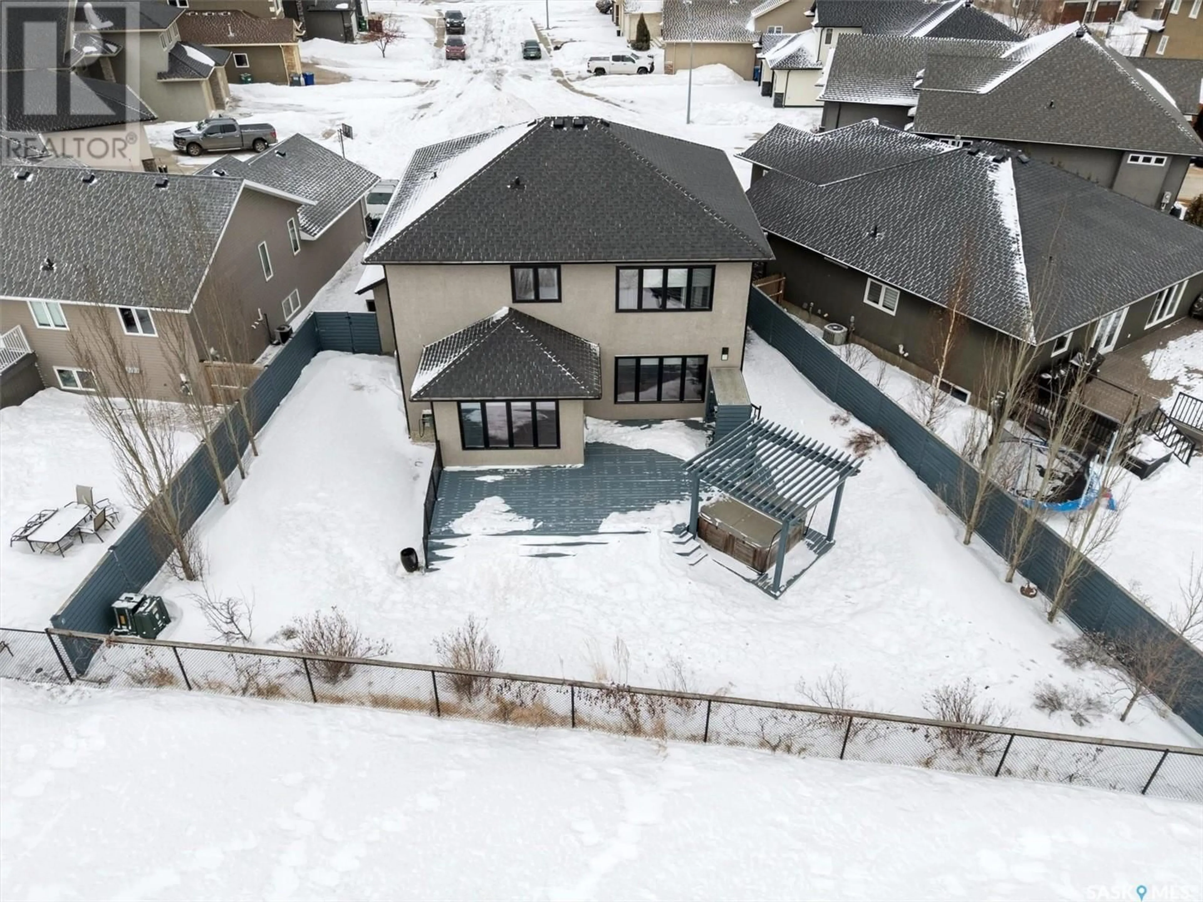 A pic from outside/outdoor area/front of a property/back of a property/a pic from drone, street for 1926 POHORECKY TERRACE, Saskatoon Saskatchewan S7W0J1