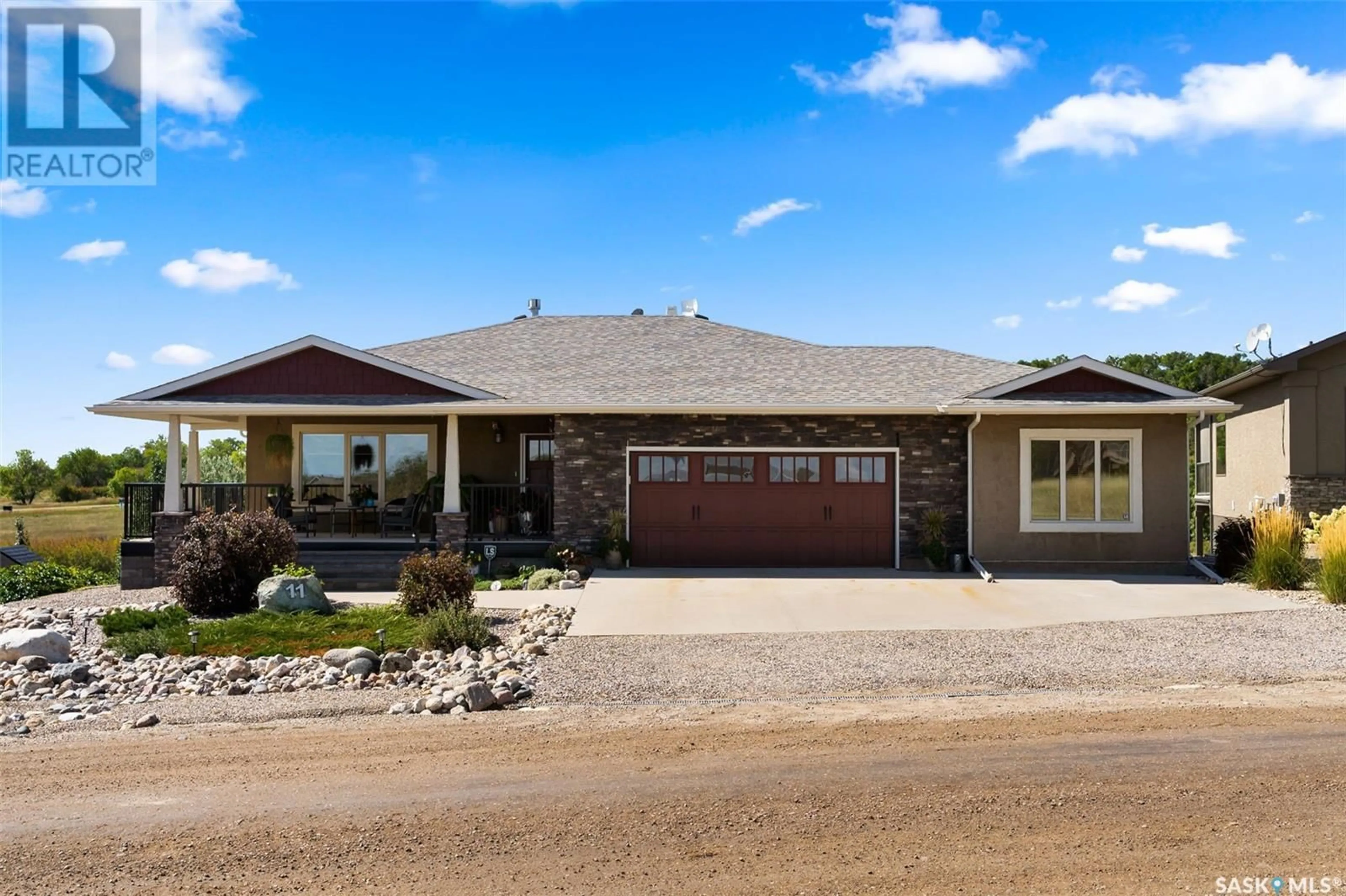 Home with vinyl exterior material, street for 11 Vista Del Sol, Sun Dale Saskatchewan S0G4L0