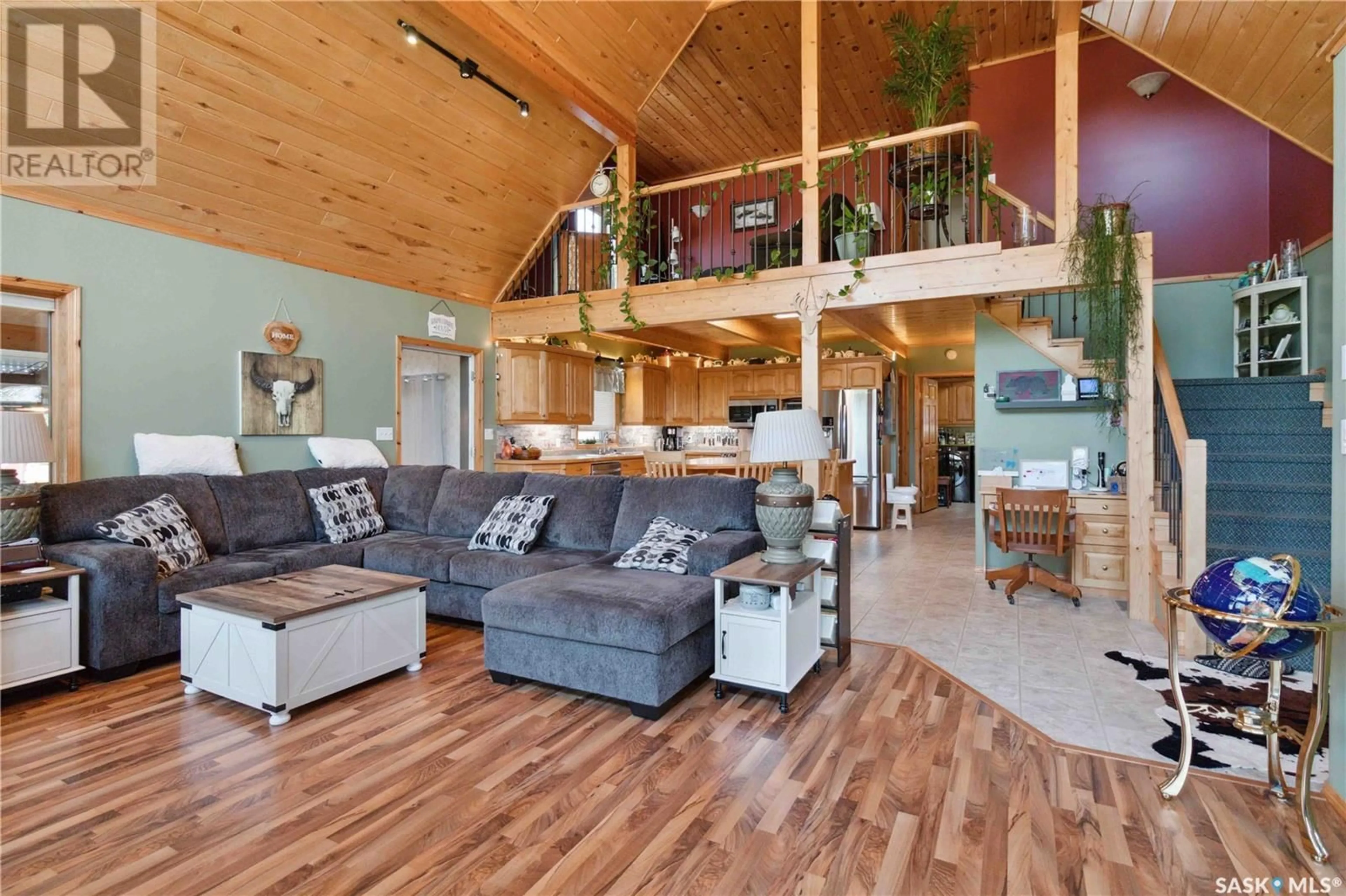 Living room with furniture, wood/laminate floor for 4 DAVID SHIELS ROAD, Dundurn Rm No. 314 Saskatchewan S7C0B2