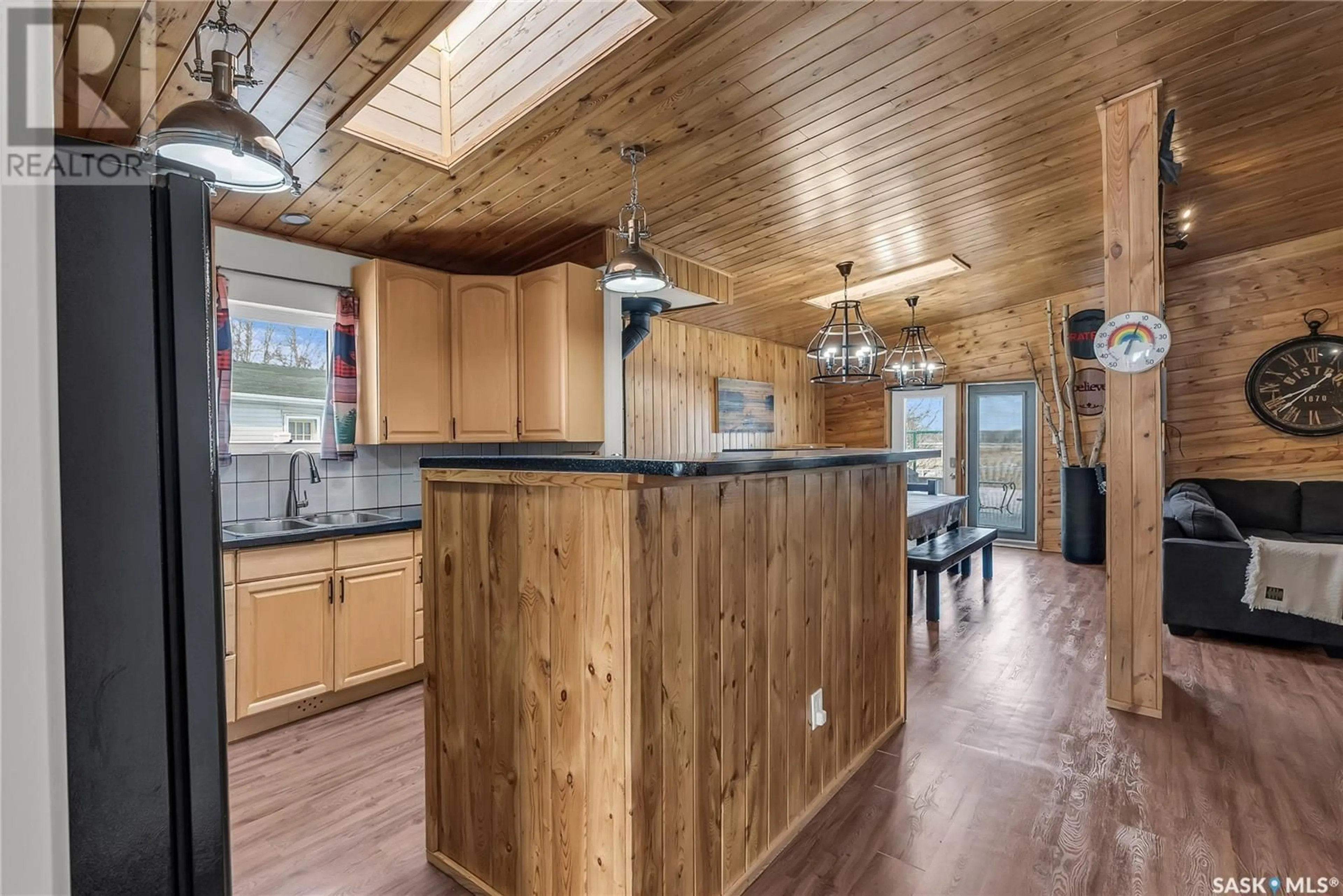Open concept kitchen, wood/laminate floor for 108 IROQUOIS LAKE DRIVE, Iroquois Lake Saskatchewan S0J2G0