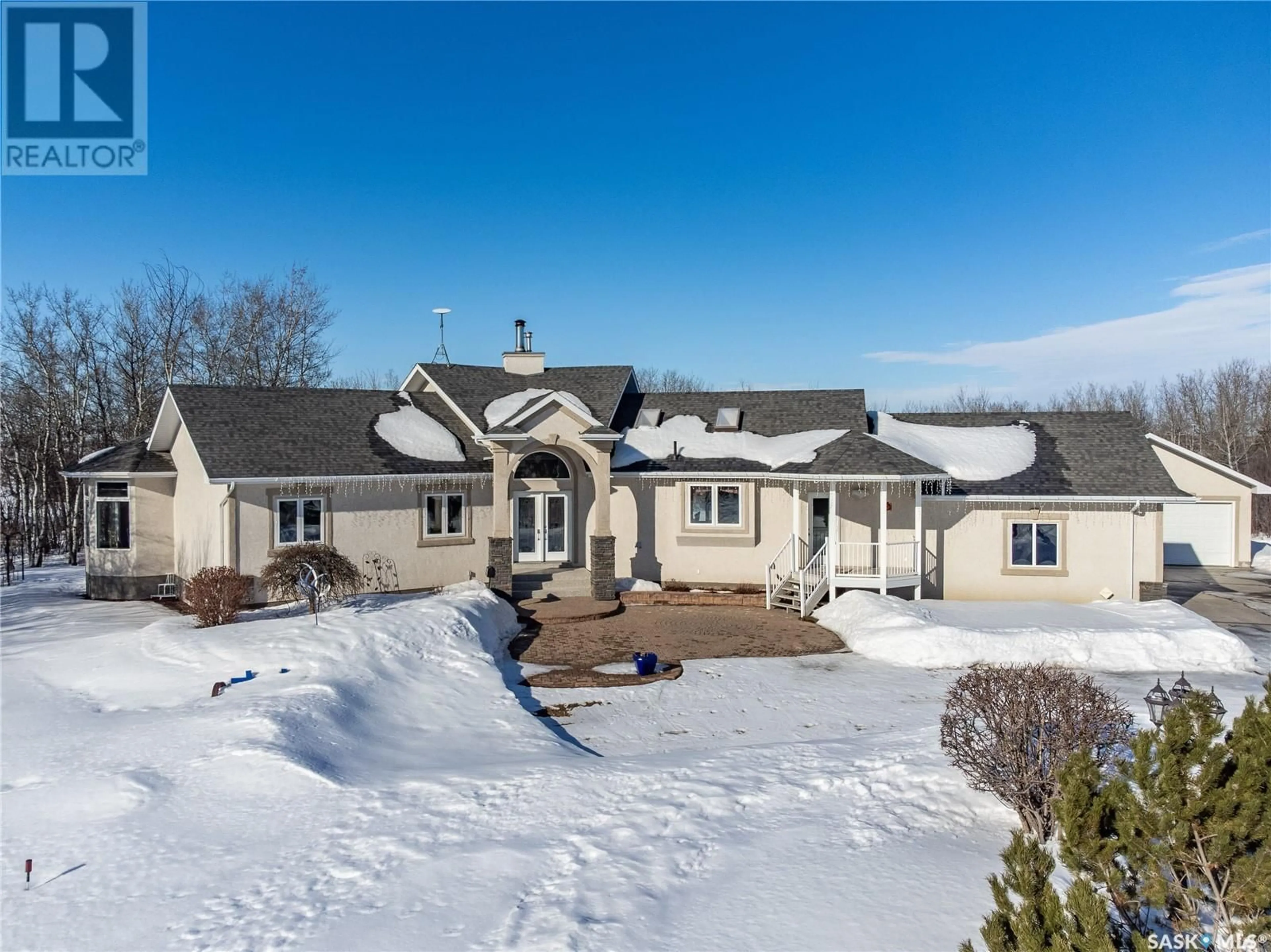 A pic from outside/outdoor area/front of a property/back of a property/a pic from drone, street for The Meadow Acreage, Corman Park Rm No. 344 Saskatchewan S7V0A9