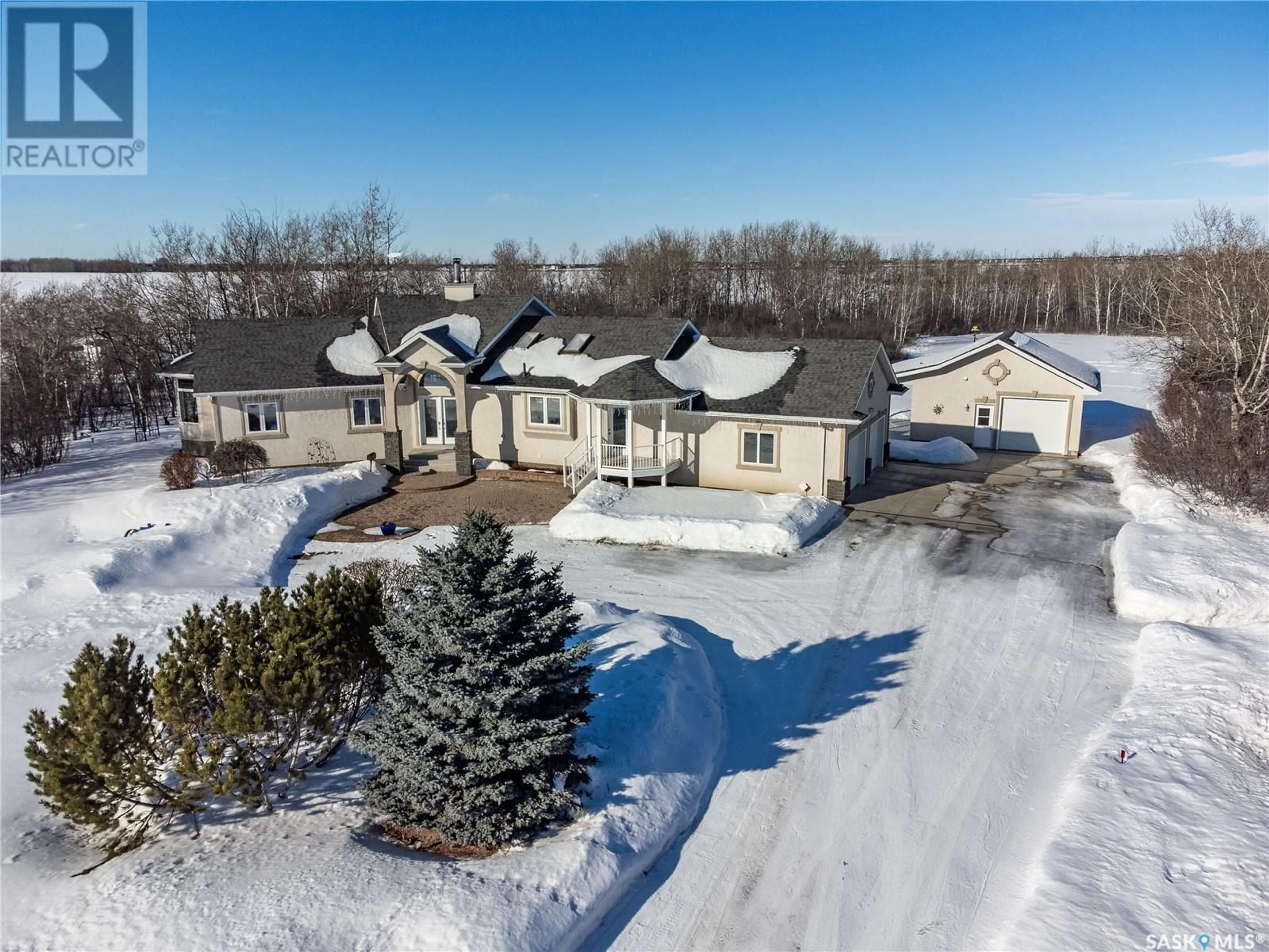 A pic from outside/outdoor area/front of a property/back of a property/a pic from drone, street for The Meadow Acreage, Corman Park Rm No. 344 Saskatchewan S7V0A9