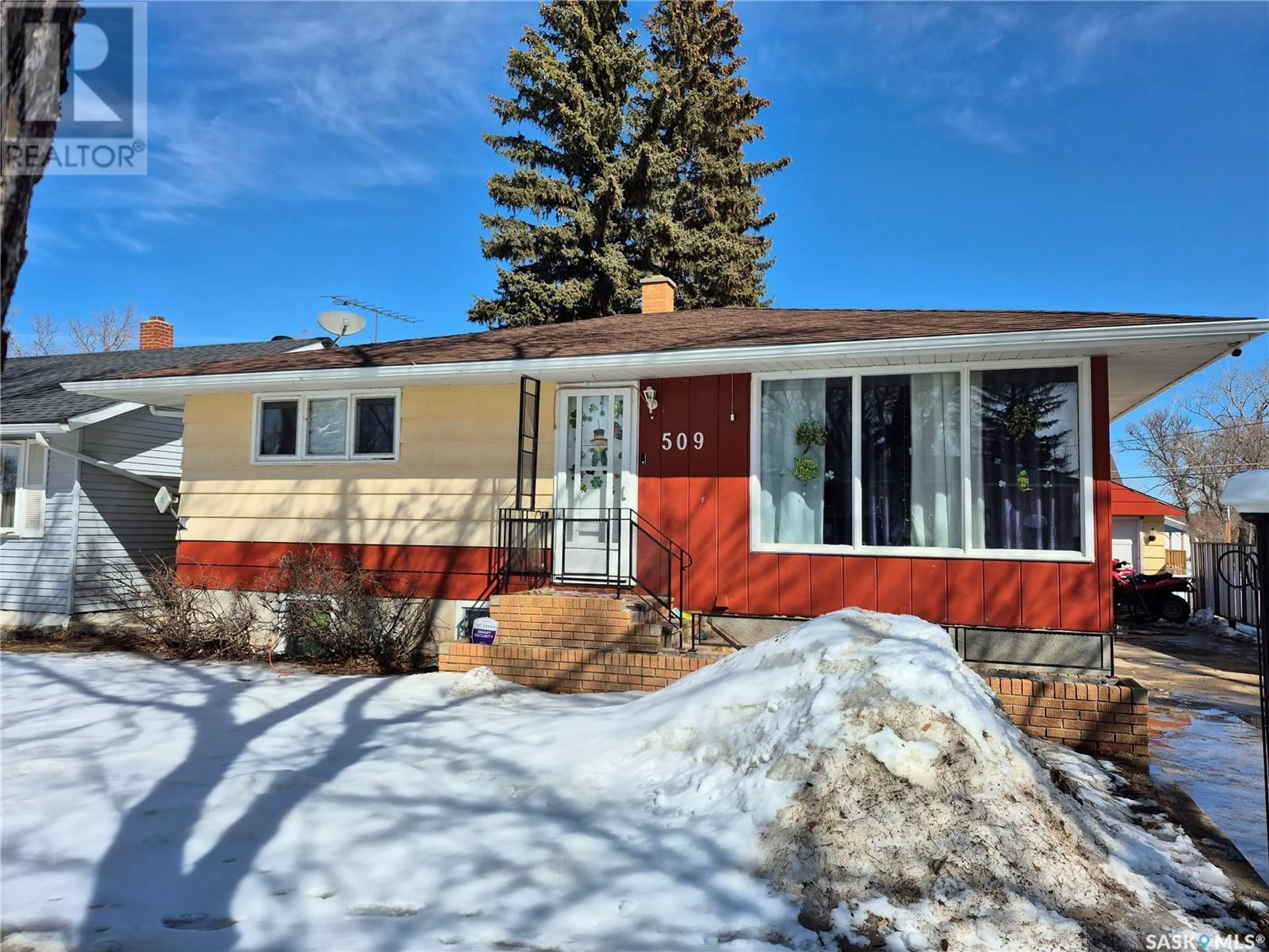 Home with vinyl exterior material, street for 509 Bertrand AVENUE, Radville Saskatchewan S0C2G0