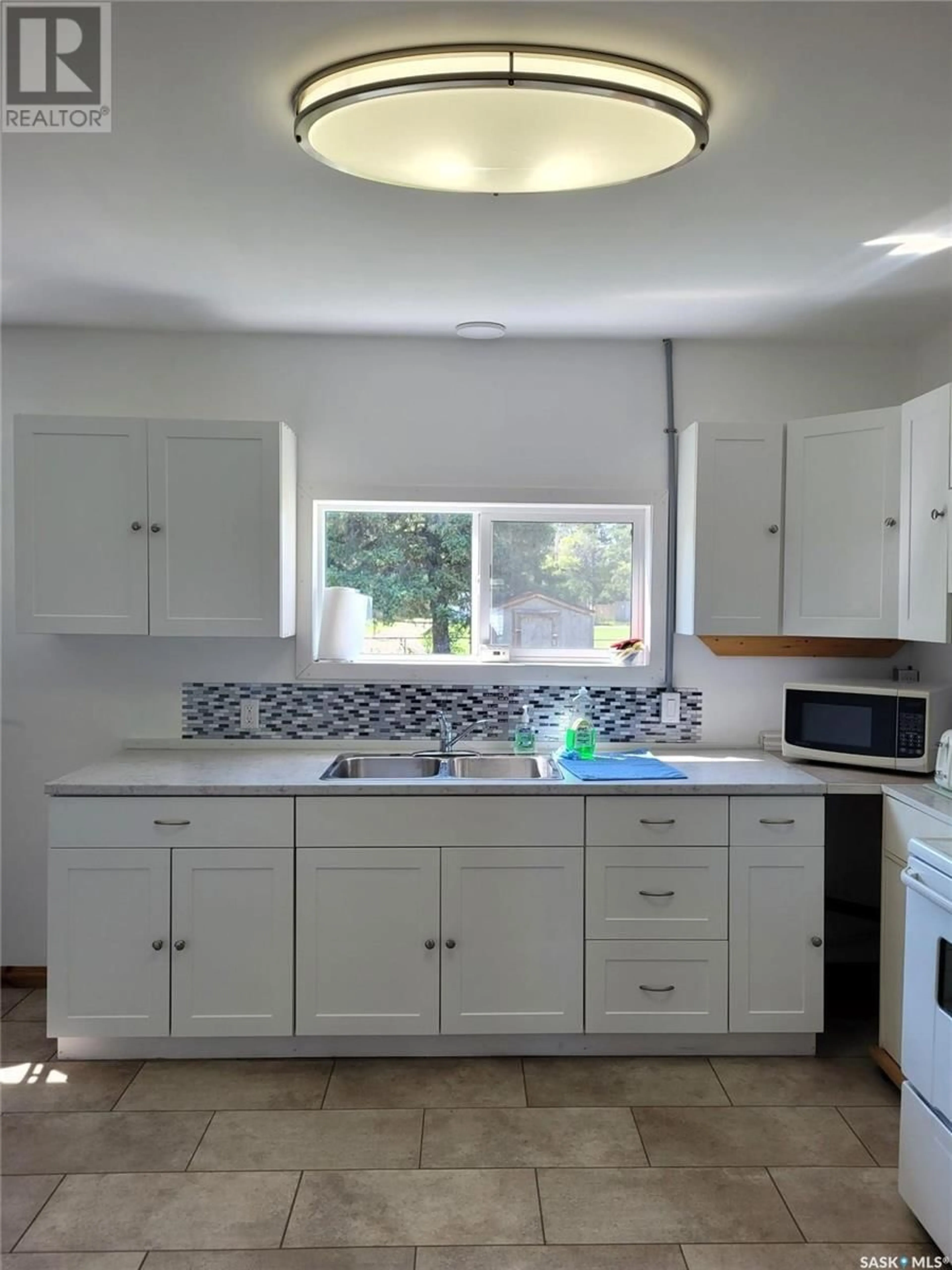 Standard kitchen, ceramic/tile floor for 211 3RD STREET, Meadow Lake Saskatchewan S9X1Y6