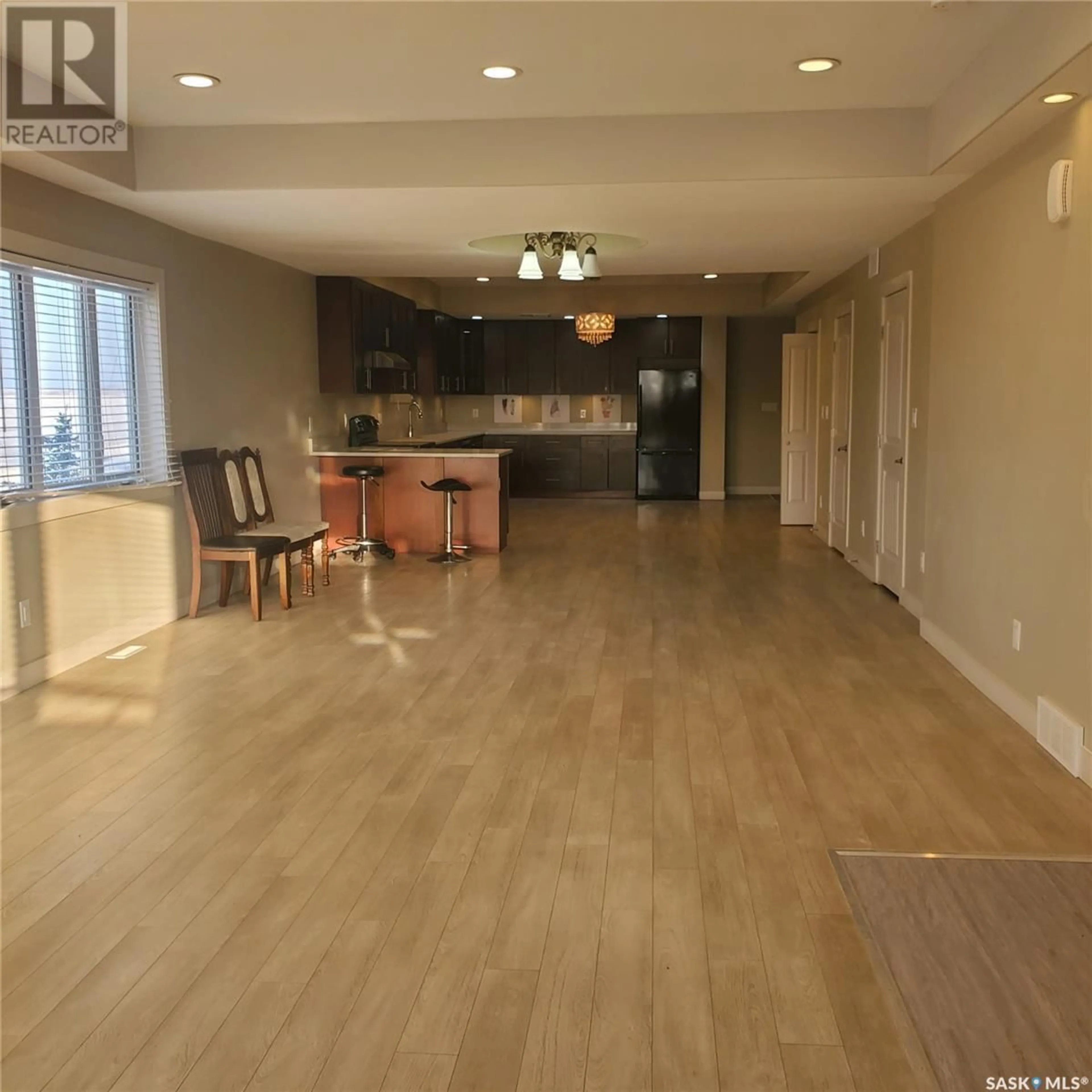 Open concept kitchen, wood/laminate floor for 1703 - 28 PATRICK CRESCENT, Saskatoon Saskatchewan S7W0G1