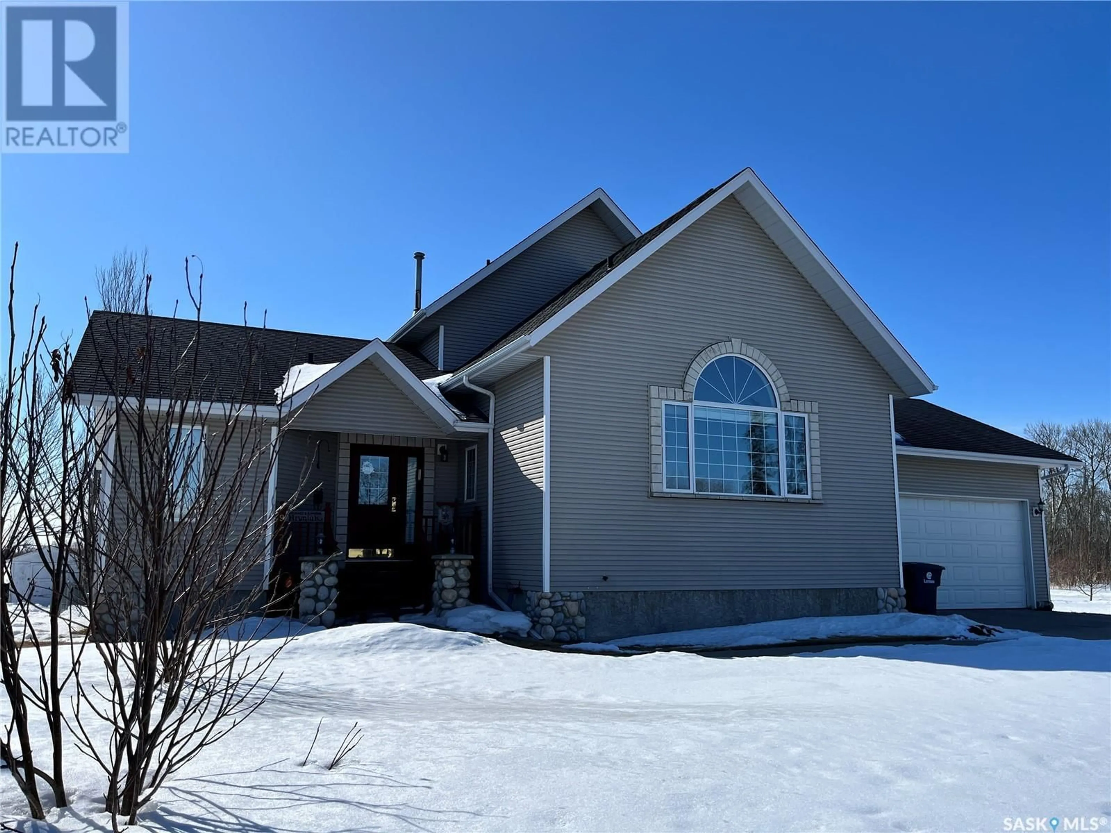 Home with vinyl exterior material, street for 9023 6th STREET, Rosthern Saskatchewan S0K4R0