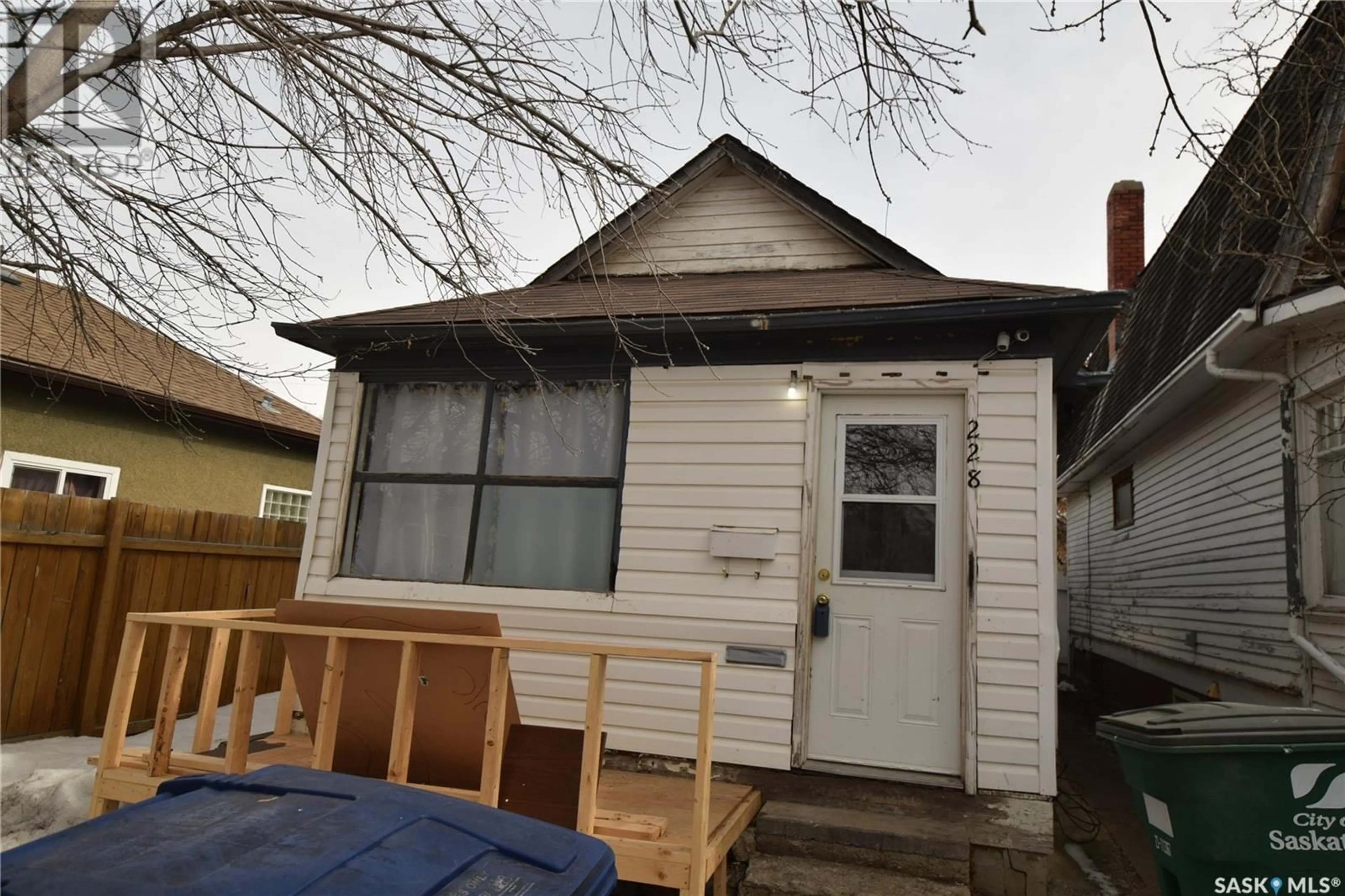 Home with vinyl exterior material, street for 228 L AVENUE, Saskatoon Saskatchewan S7L2P4