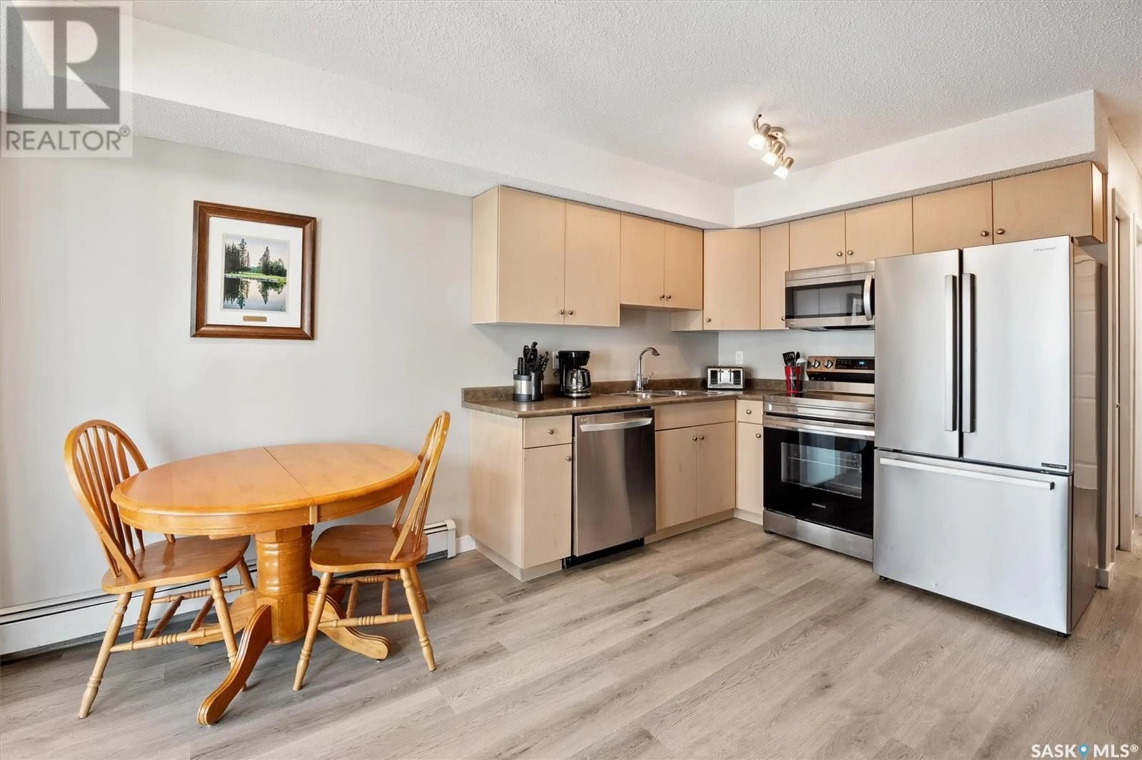 Standard kitchen, wood/laminate floor for 406 303 Lowe ROAD, Saskatoon Saskatchewan S7S1P2