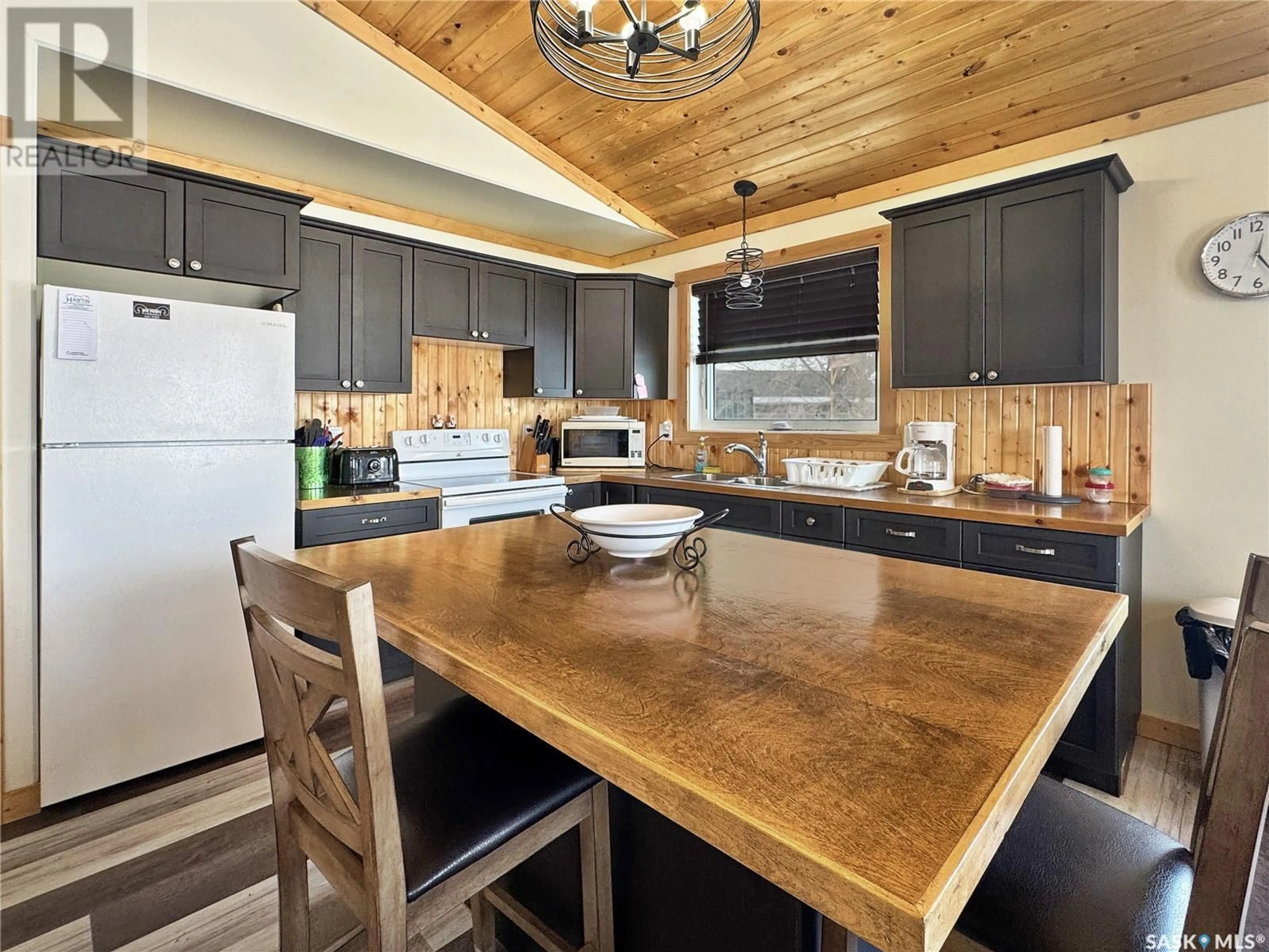 Open concept kitchen, wood/laminate floor for 140 McLennan DRIVE, Cochin Saskatchewan S0M0L0