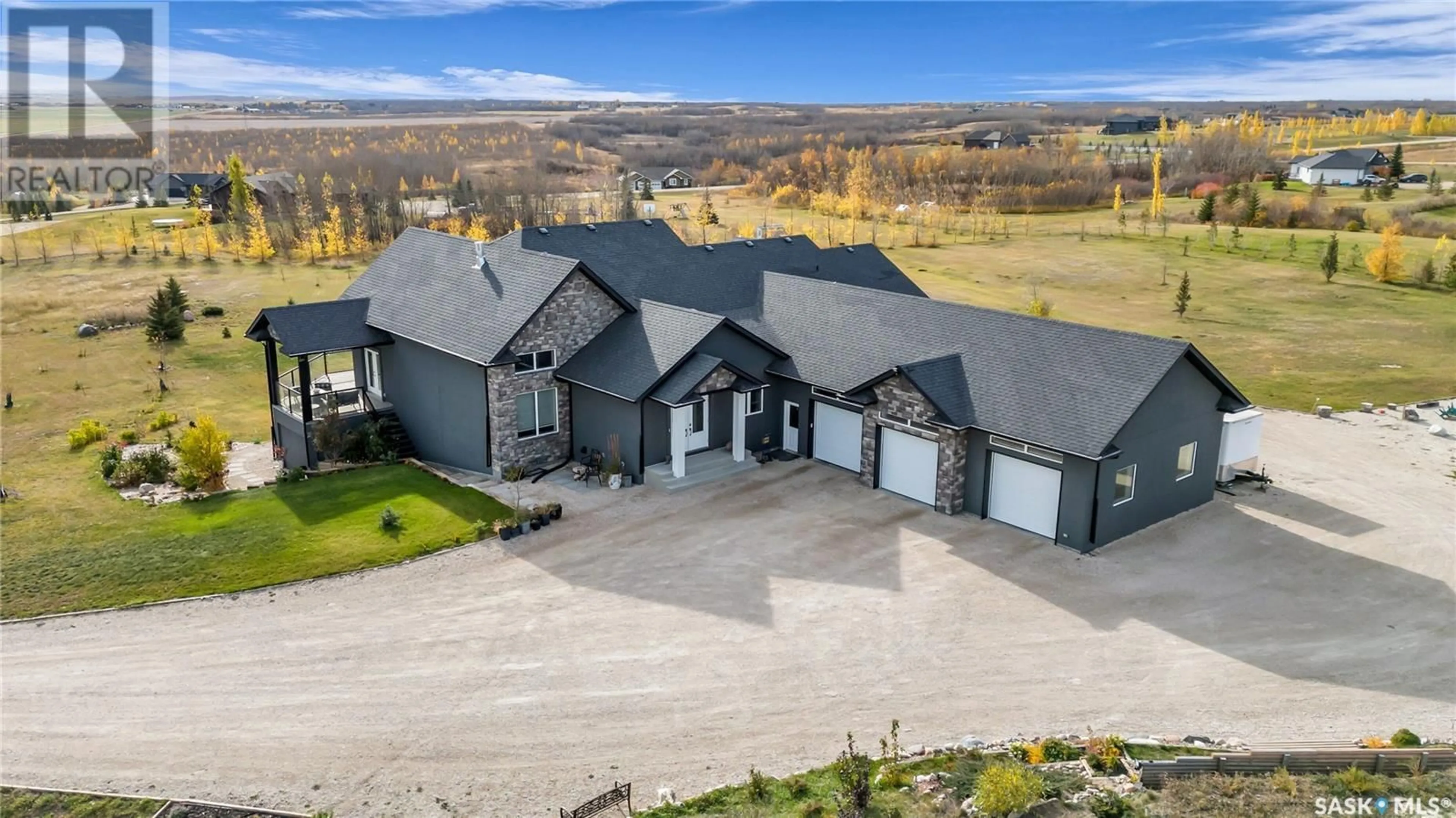 A pic from outside/outdoor area/front of a property/back of a property/a pic from drone, mountain view for 104 Aspen WAY, Aberdeen Rm No. 373 Saskatchewan S7K3J9