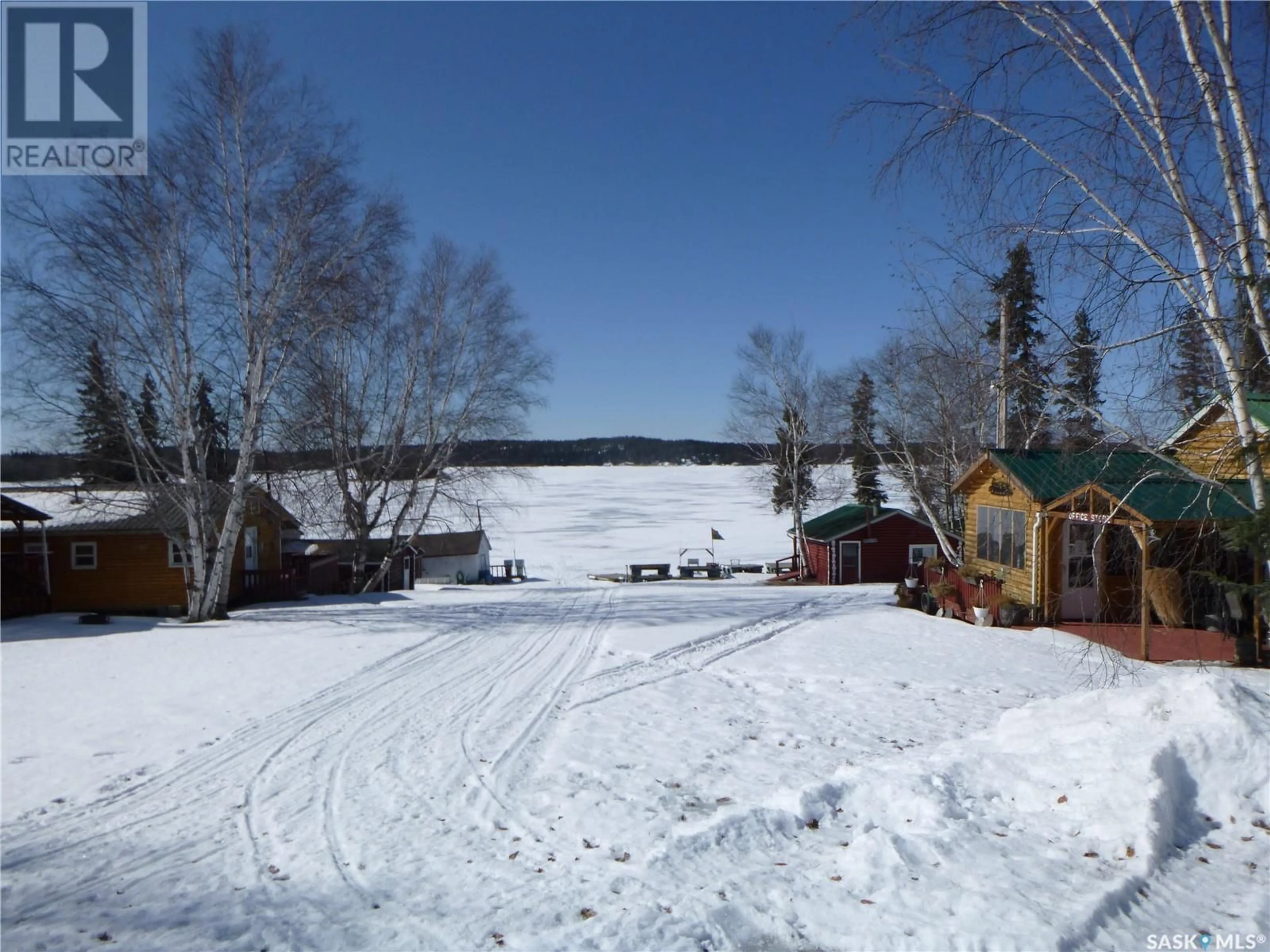 A pic from outside/outdoor area/front of a property/back of a property/a pic from drone, water/lake/river/ocean view for 1006 LAKE ROAD, Northern Admin District Saskatchewan S0P0A0