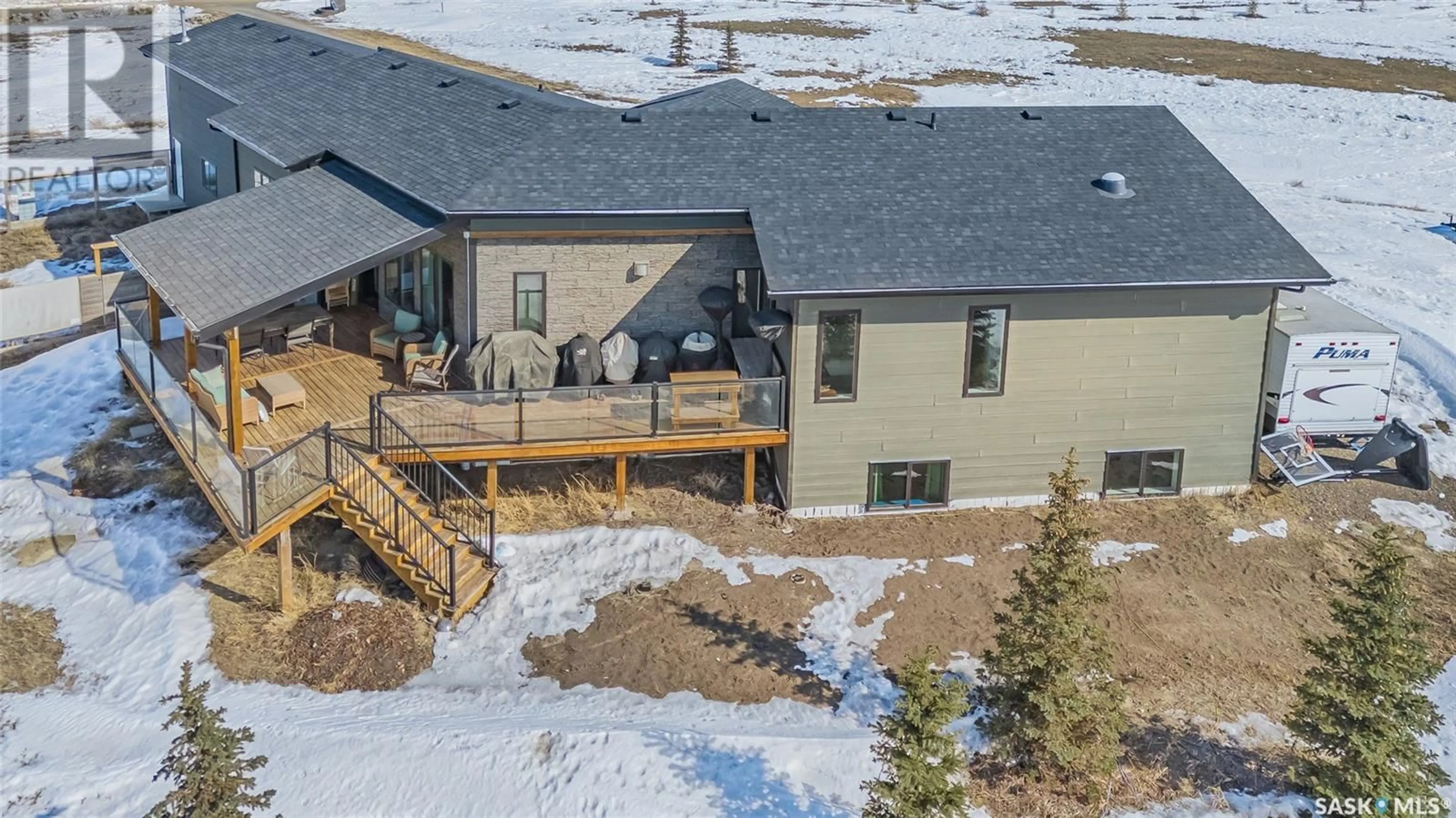 A pic from outside/outdoor area/front of a property/back of a property/a pic from drone, mountain view for 101 Deer Run CRESCENT, Bergheim Estates Saskatchewan S7A0A6