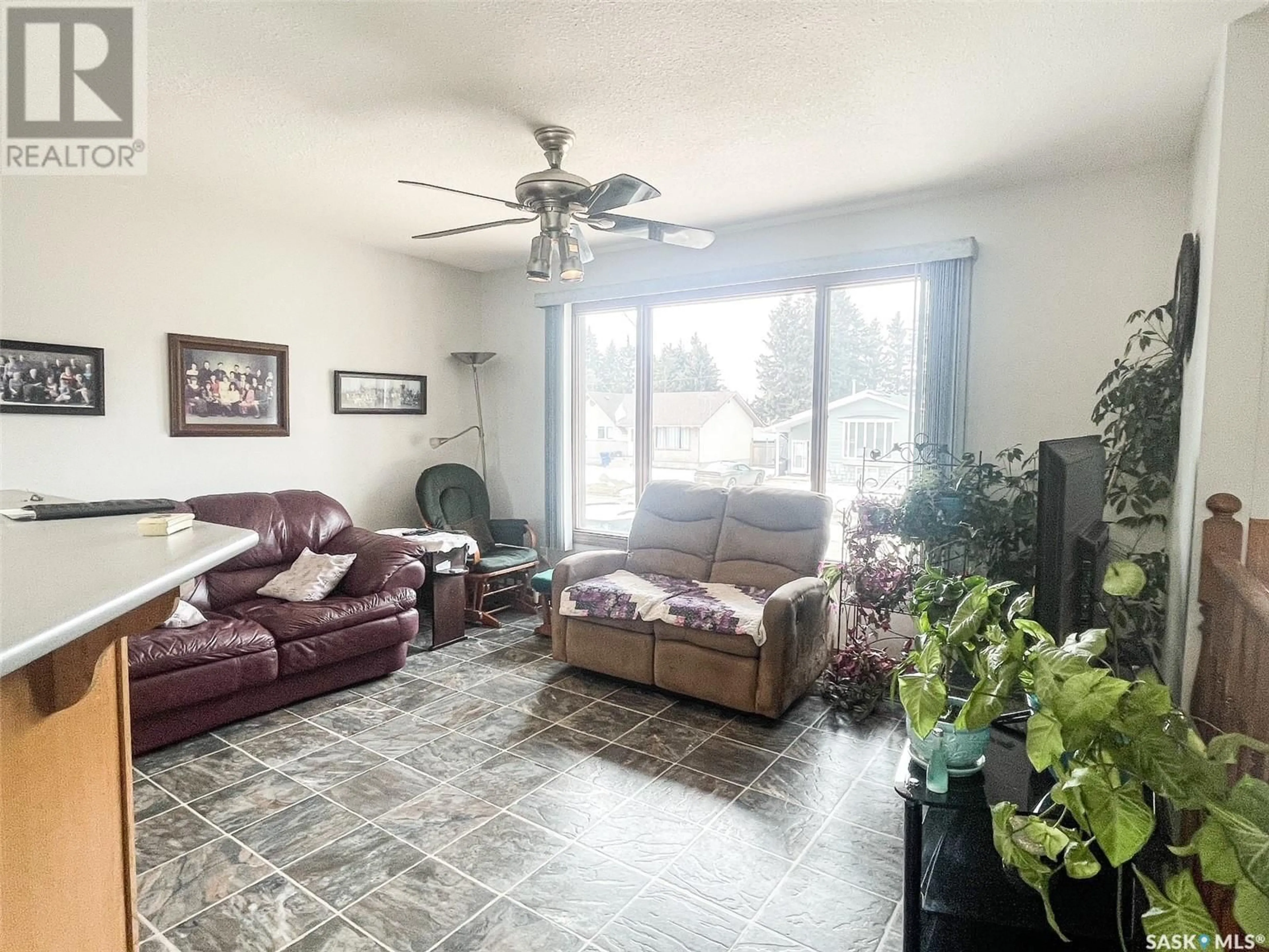 Living room with furniture, ceramic/tile floor for 608 2nd STREET W, Meadow Lake Saskatchewan S9X1E1