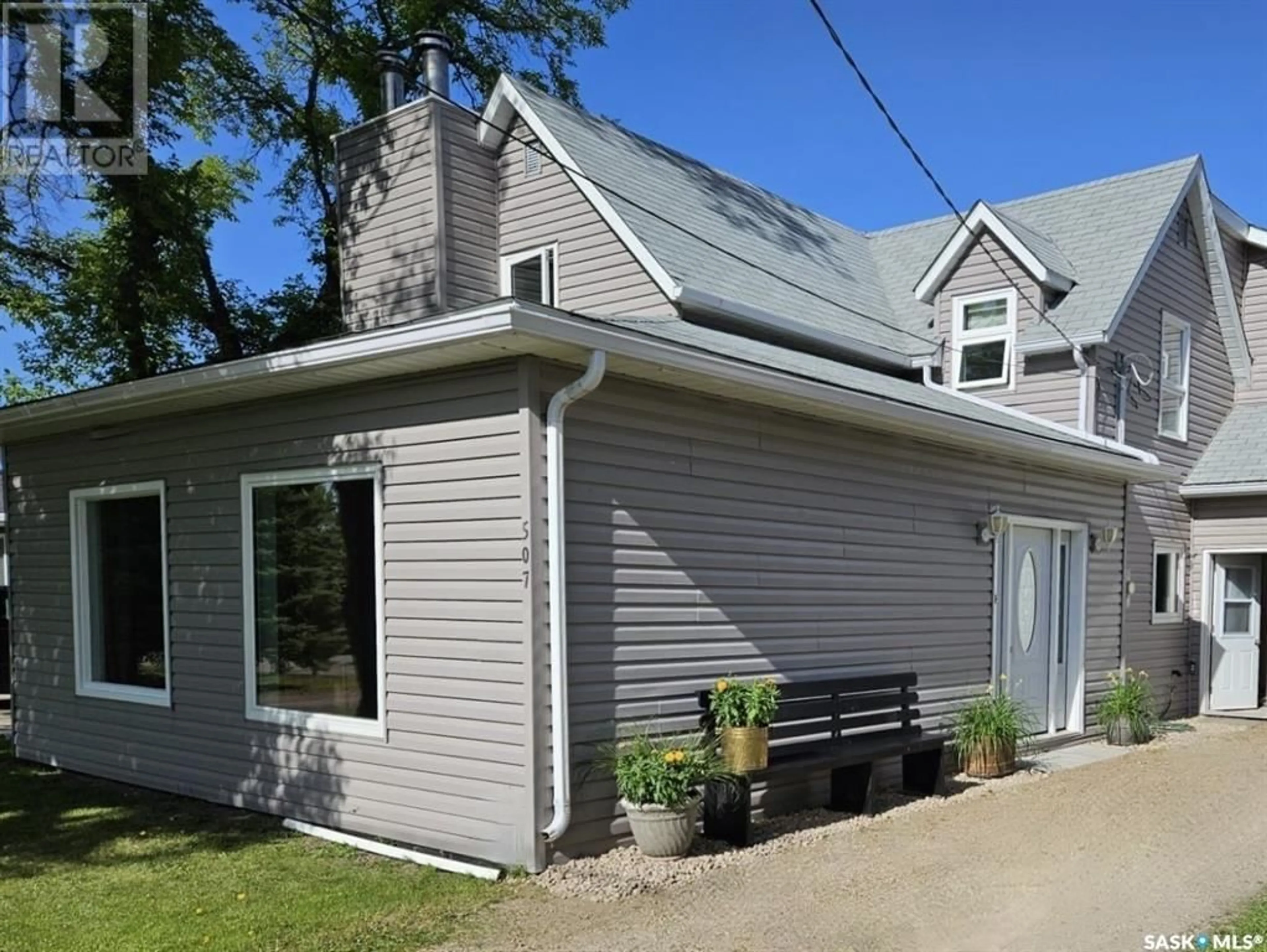 Home with vinyl exterior material, street for 507 PHEASANT STREET, Grenfell Saskatchewan S0G2B0