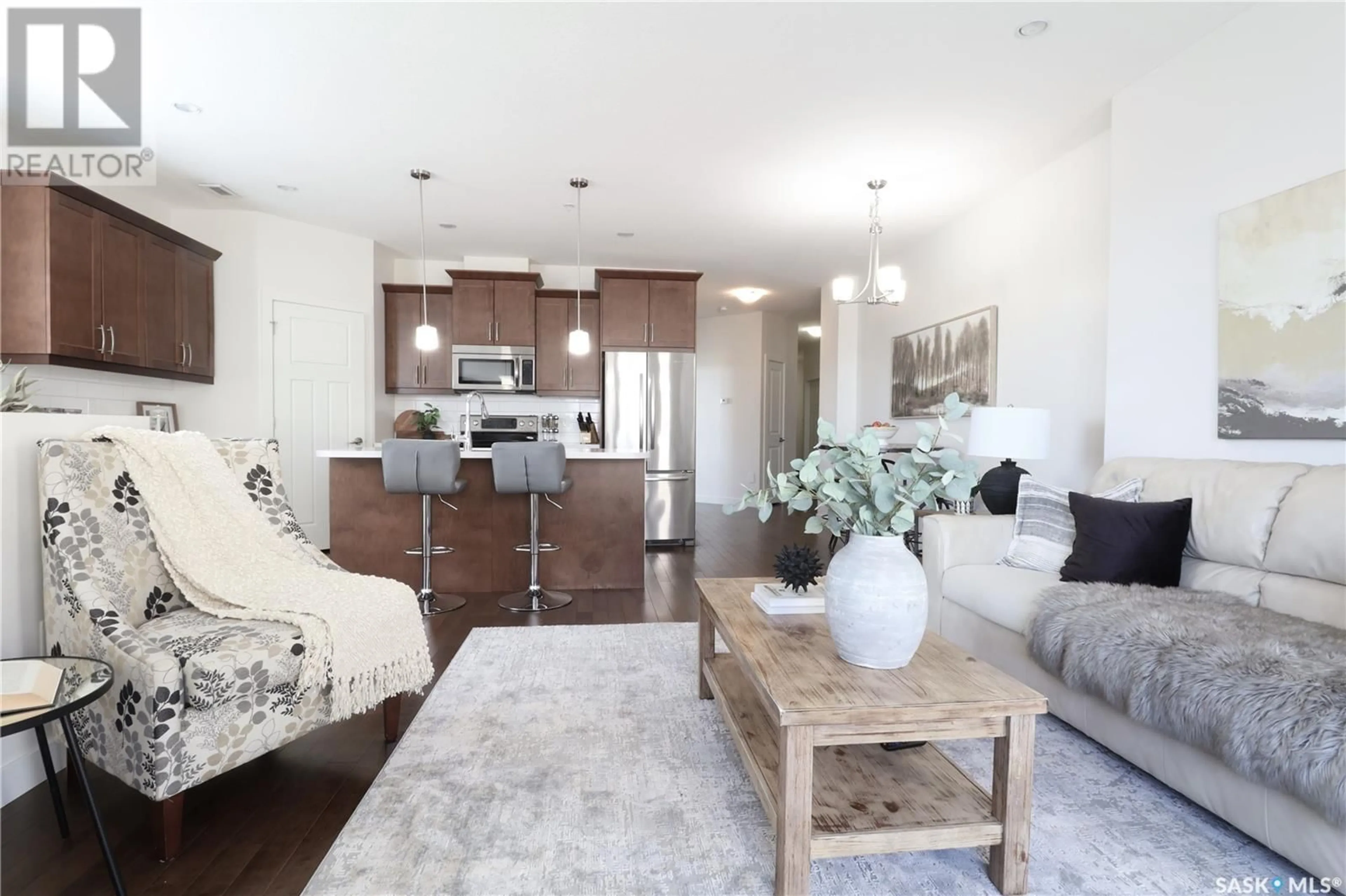 Living room with furniture, wood/laminate floor for 908 - 2055 ROSE STREET, Regina Saskatchewan S4P2A3