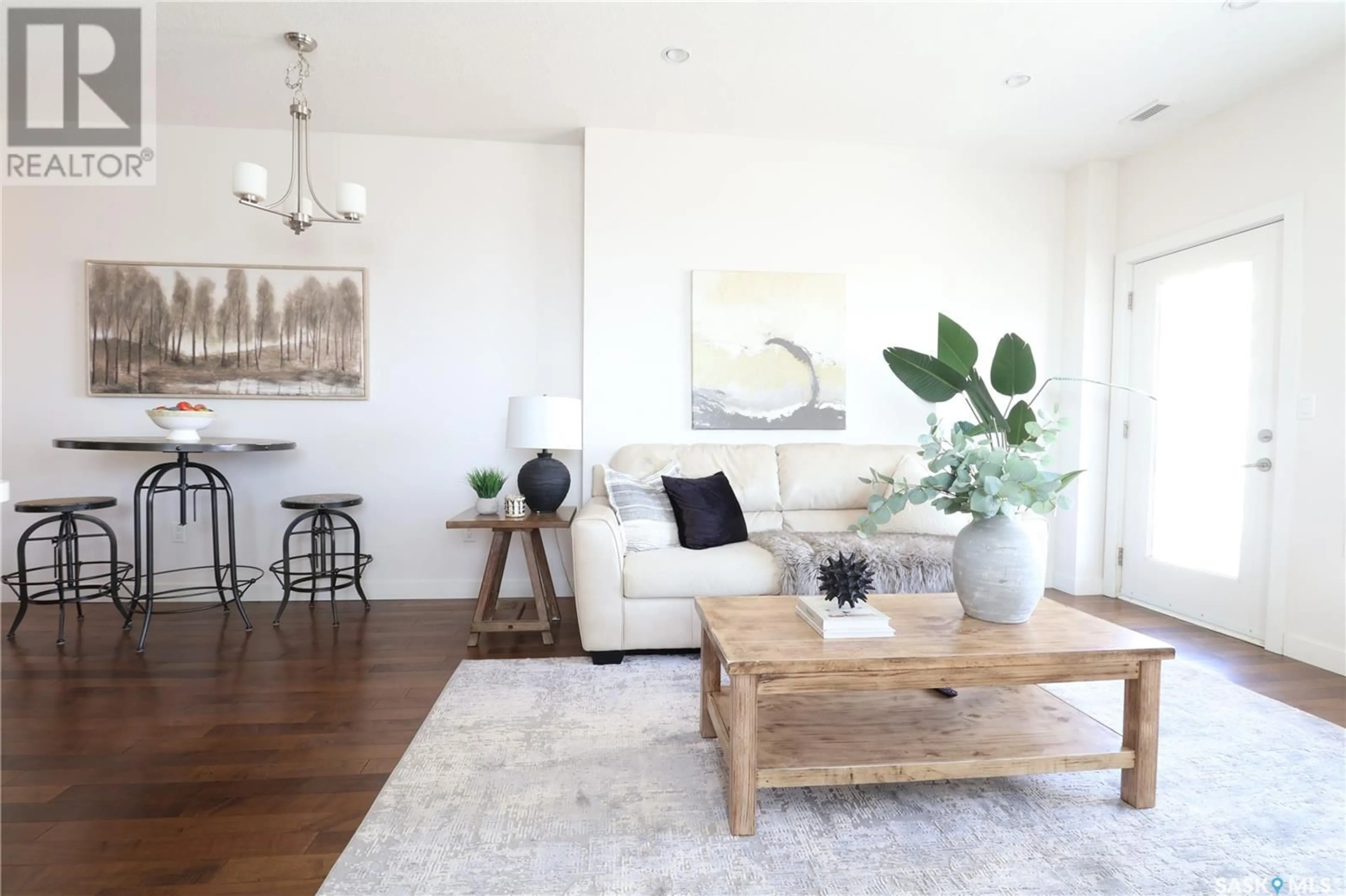 Living room with furniture, wood/laminate floor for 908 - 2055 ROSE STREET, Regina Saskatchewan S4P2A3