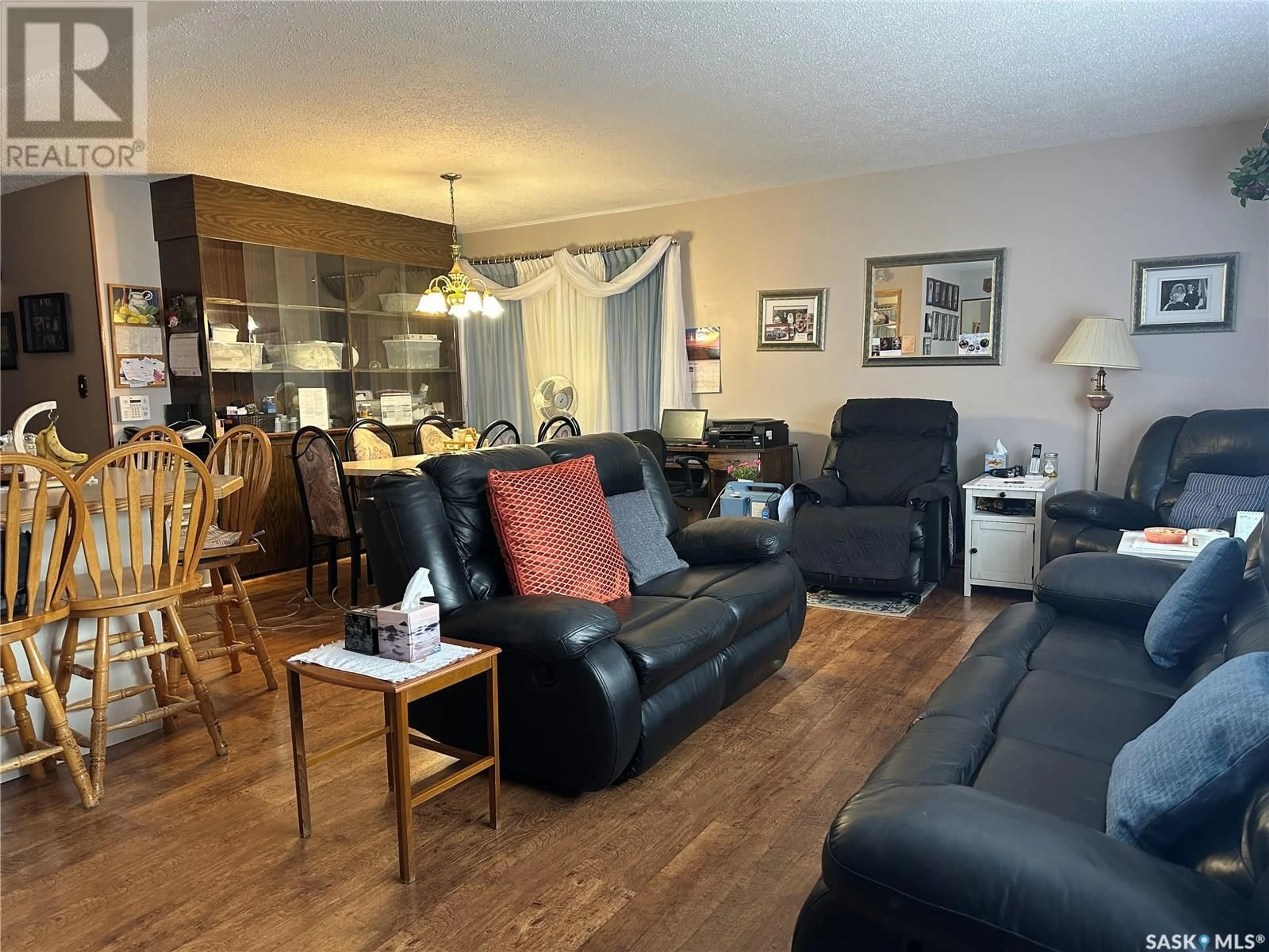Living room with furniture, wood/laminate floor for 525 MAIN STREET, Radville Saskatchewan S0C2G0