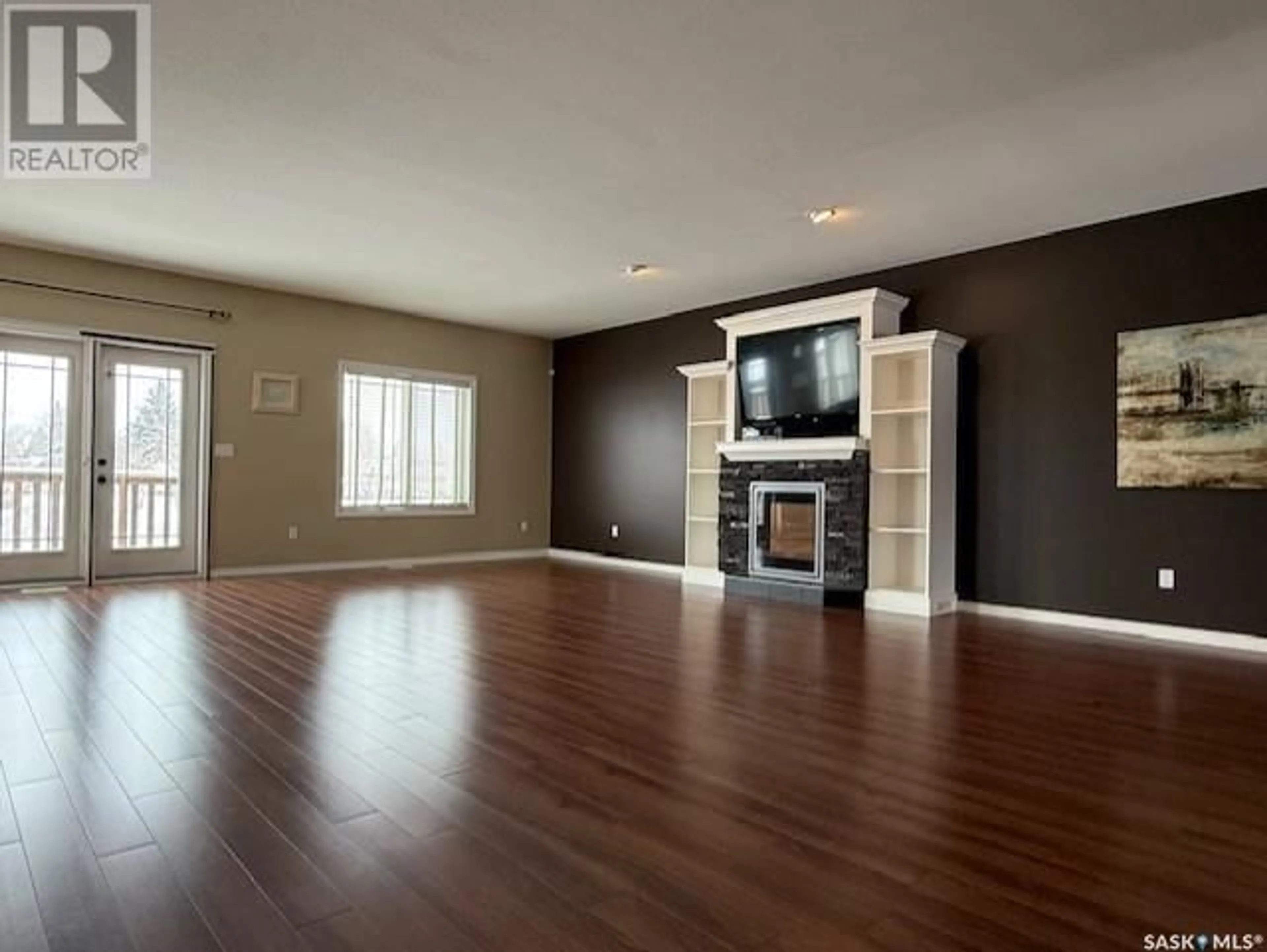 Living room with furniture, wood/laminate floor for 9 PARK BOULEVARD, Melville Saskatchewan S0A2P0