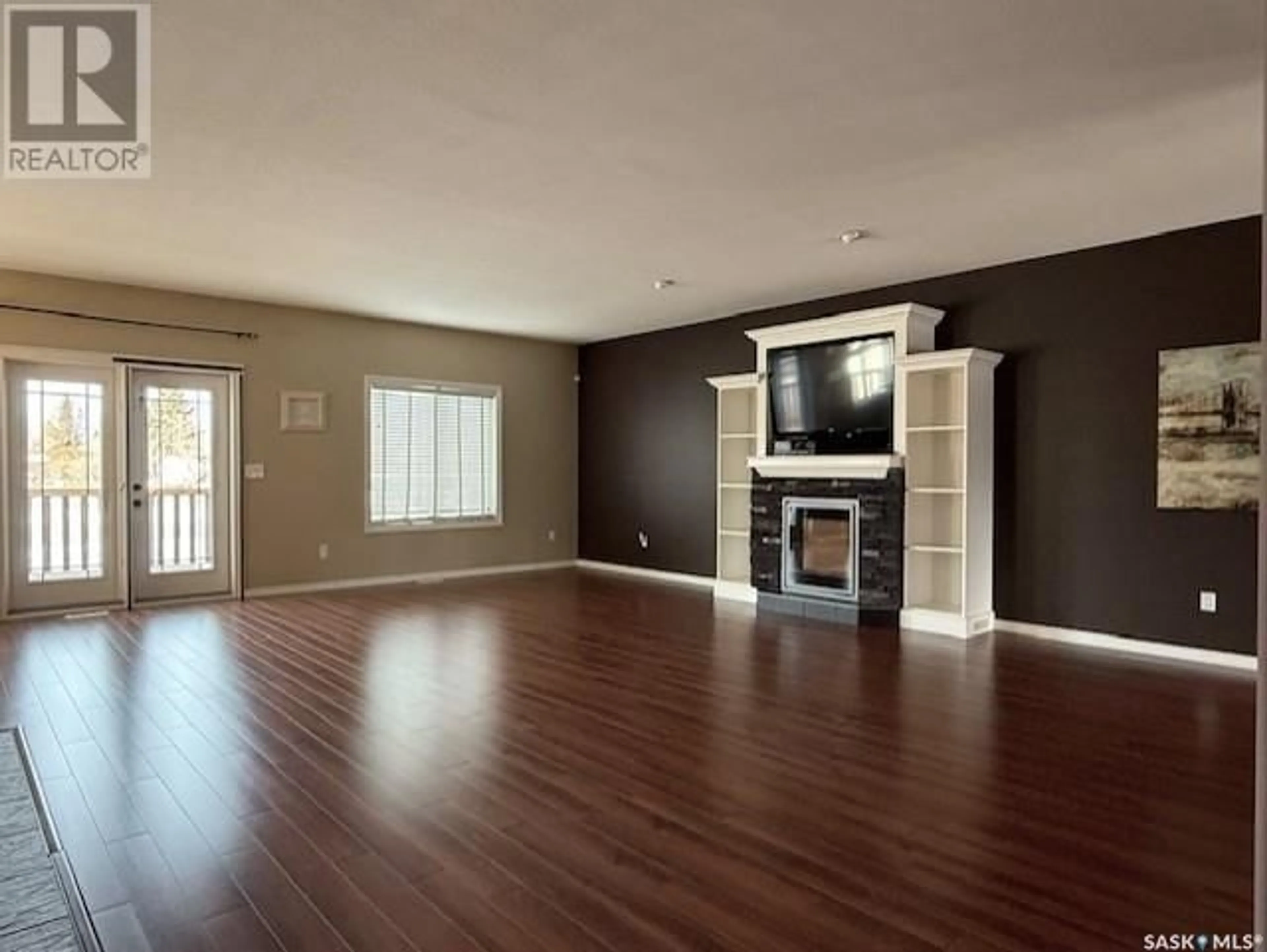 Living room with furniture, wood/laminate floor for 9 PARK BOULEVARD, Melville Saskatchewan S0A2P0