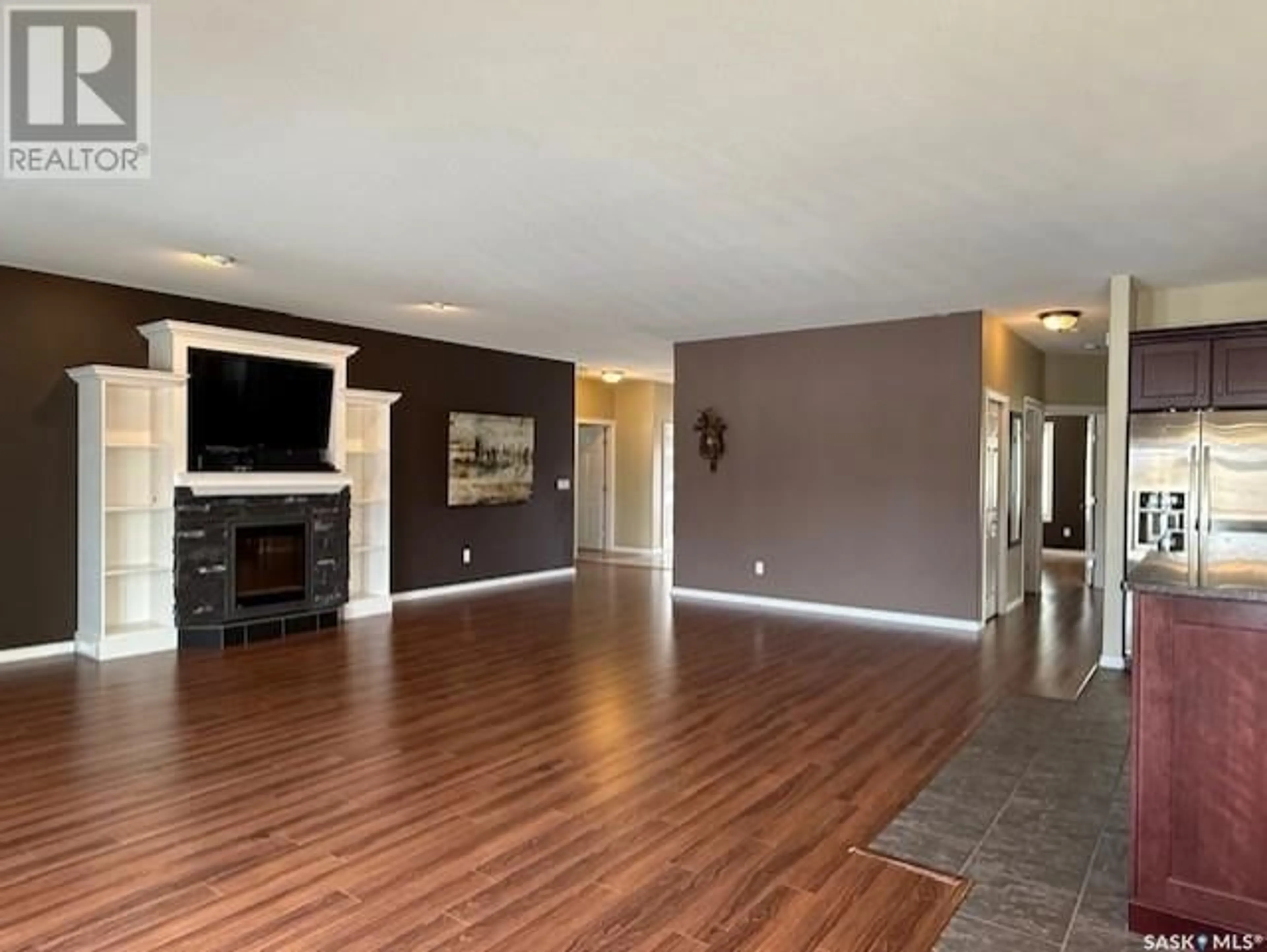 Living room with furniture, wood/laminate floor for 9 PARK BOULEVARD, Melville Saskatchewan S0A2P0