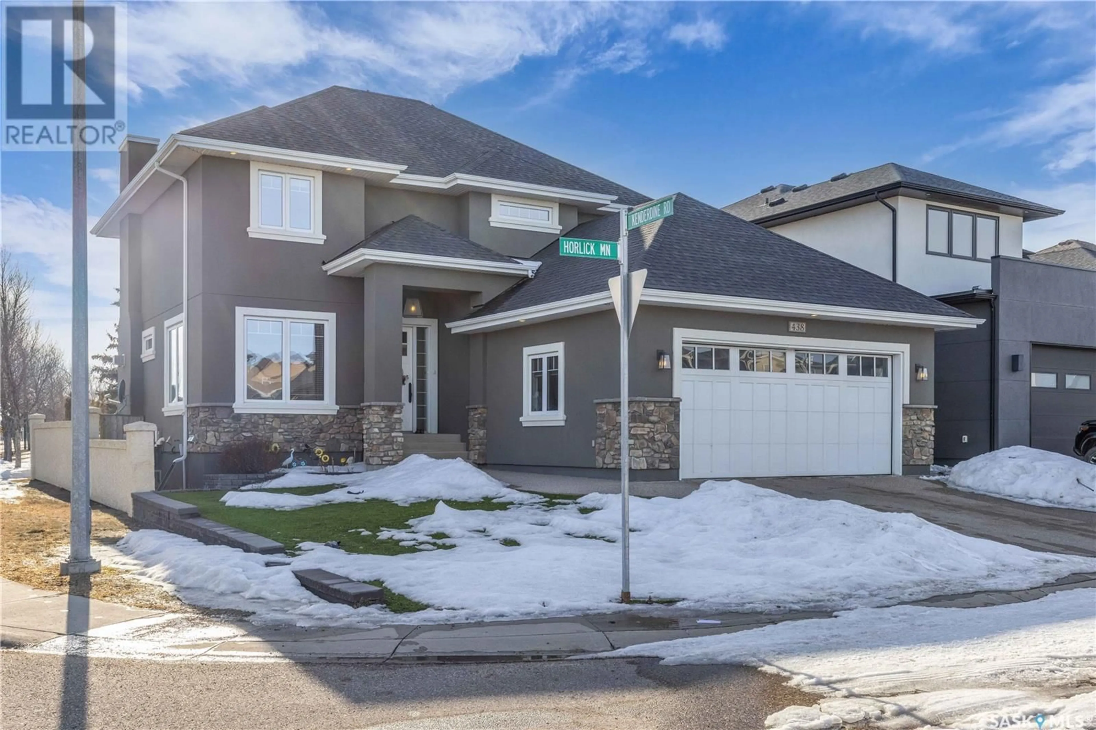 Home with vinyl exterior material, street for 438 HORLICK MANOR, Saskatoon Saskatchewan S7N2J6