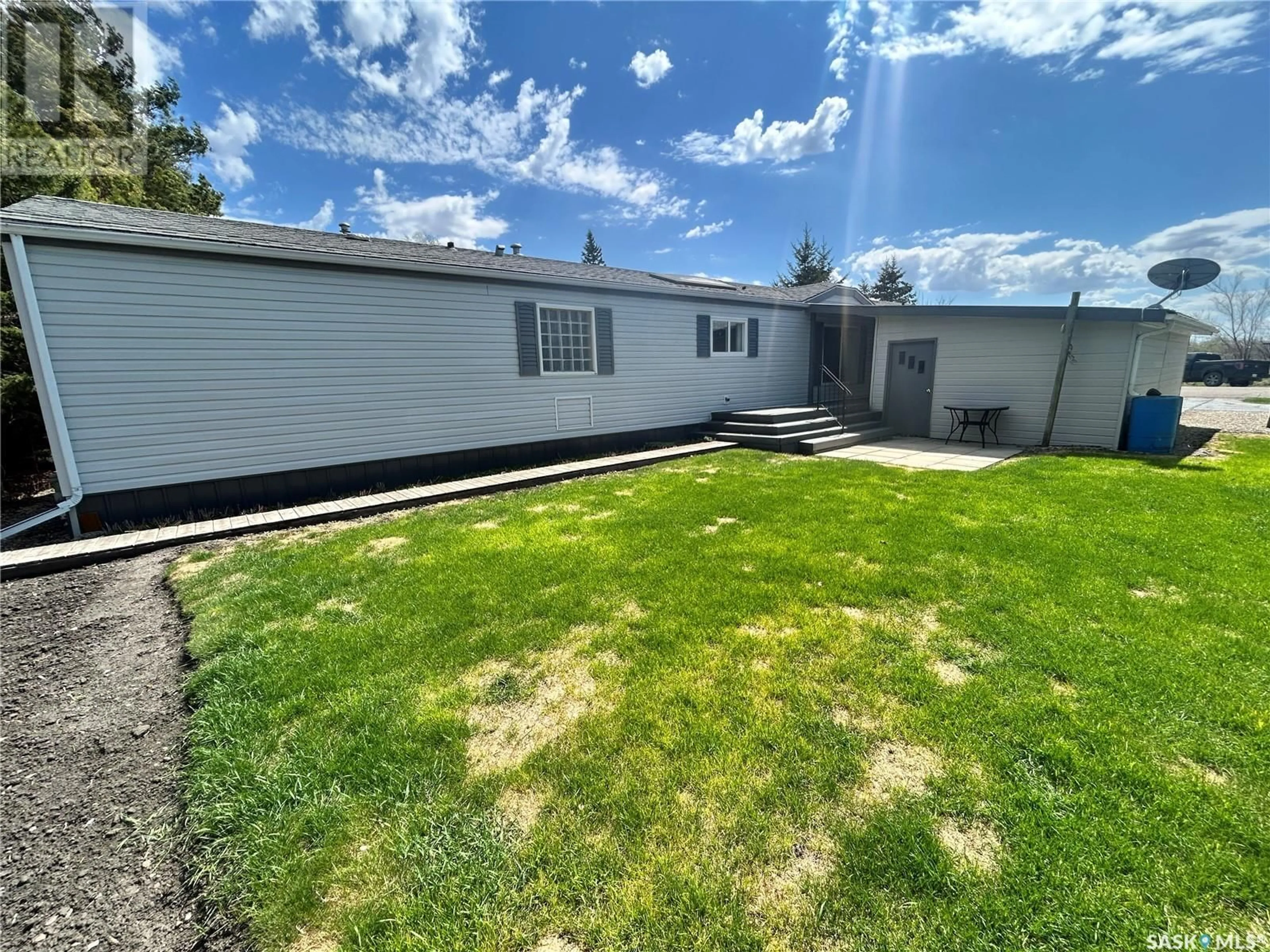 A pic from outside/outdoor area/front of a property/back of a property/a pic from drone, street for E - 518 MARCH AVENUE, Langenburg Saskatchewan S0A2A0