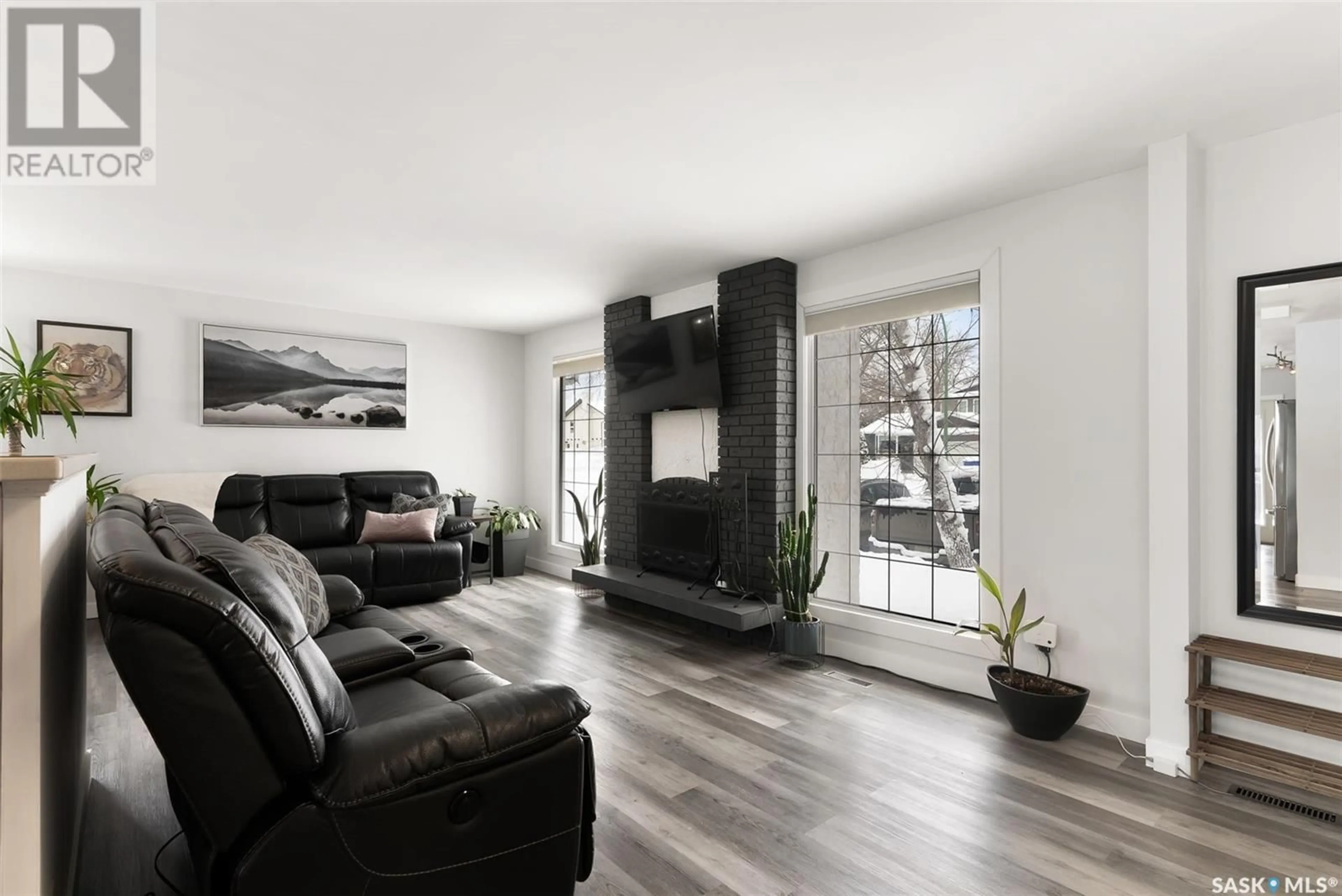 Living room with furniture, wood/laminate floor for 35 SOMMERFELD DRIVE, Regina Saskatchewan S4V0C6