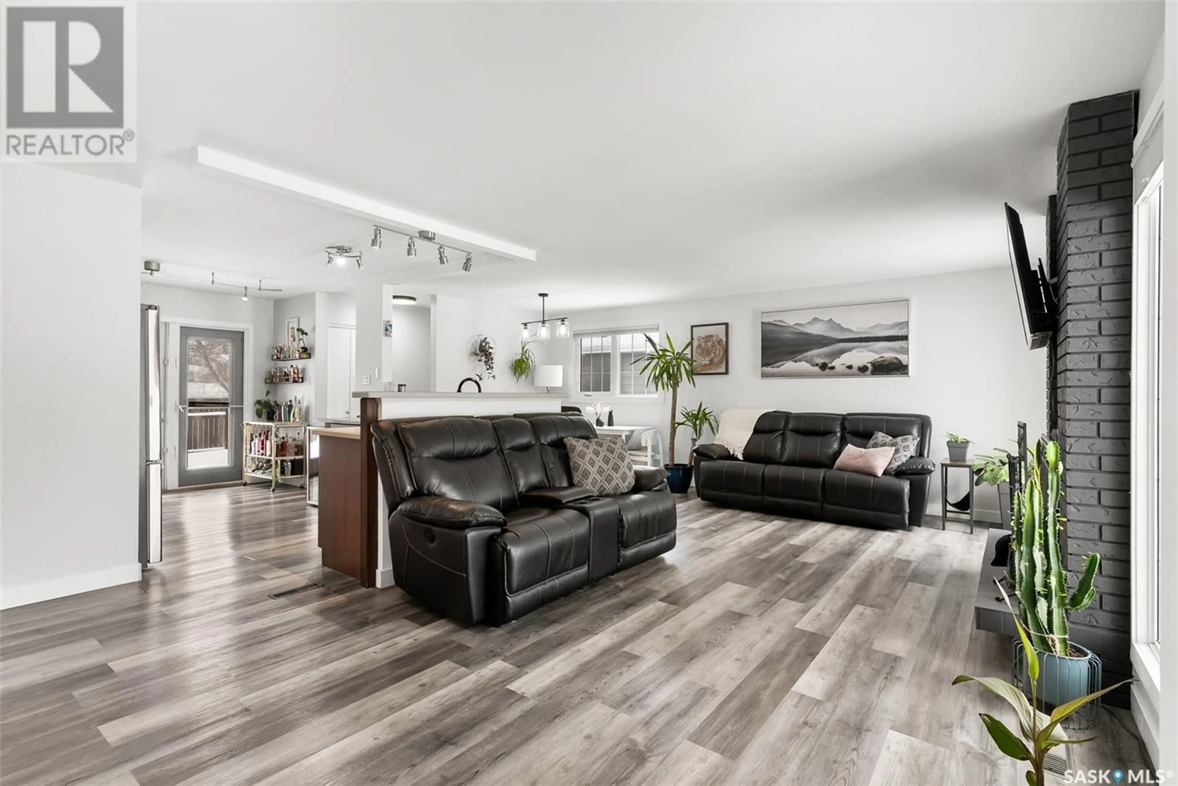 Living room with furniture, wood/laminate floor for 35 SOMMERFELD DRIVE, Regina Saskatchewan S4V0C6