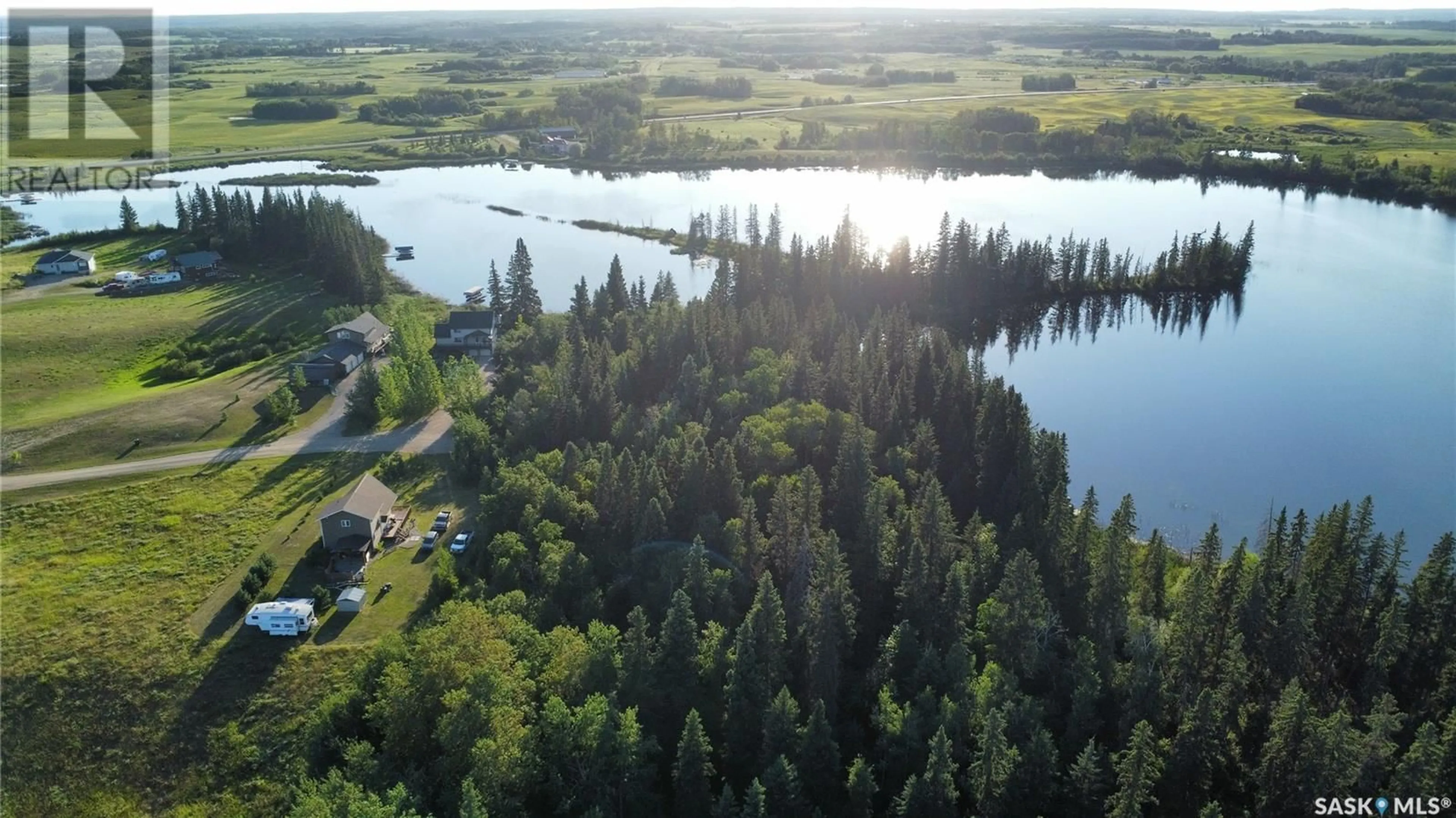 A pic from outside/outdoor area/front of a property/back of a property/a pic from drone, water/lake/river/ocean view for 13 JADE LANE, Shell Lake Saskatchewan S0J2G0