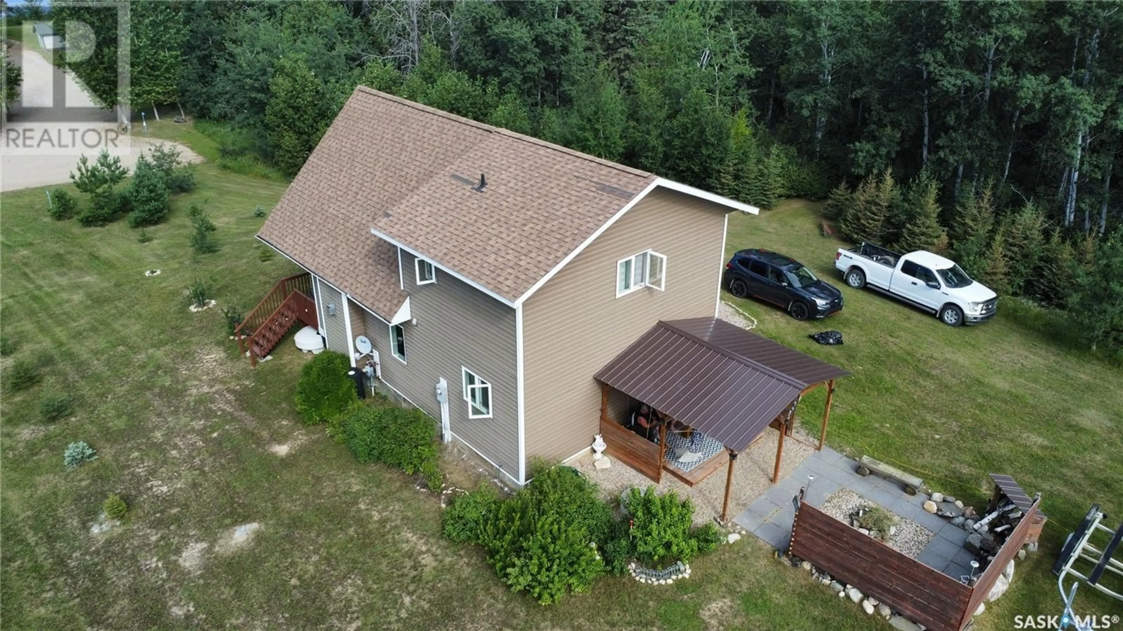 A pic from outside/outdoor area/front of a property/back of a property/a pic from drone, building for 13 JADE LANE, Shell Lake Saskatchewan S0J2G0